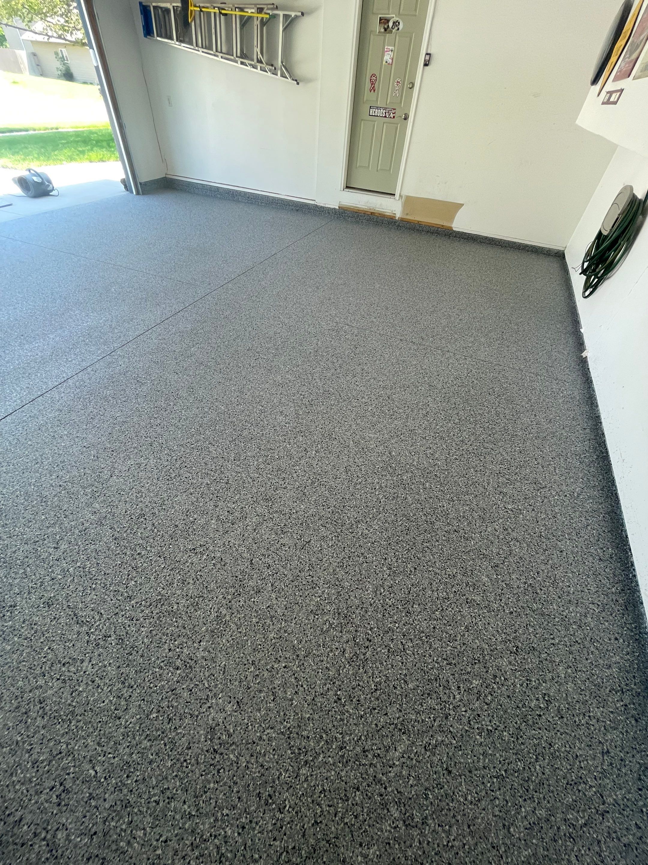Sioux Falls Garage Floor Coating with Nightfall Decorative Chips by Select Painting, Coatings & Garage Cabinets