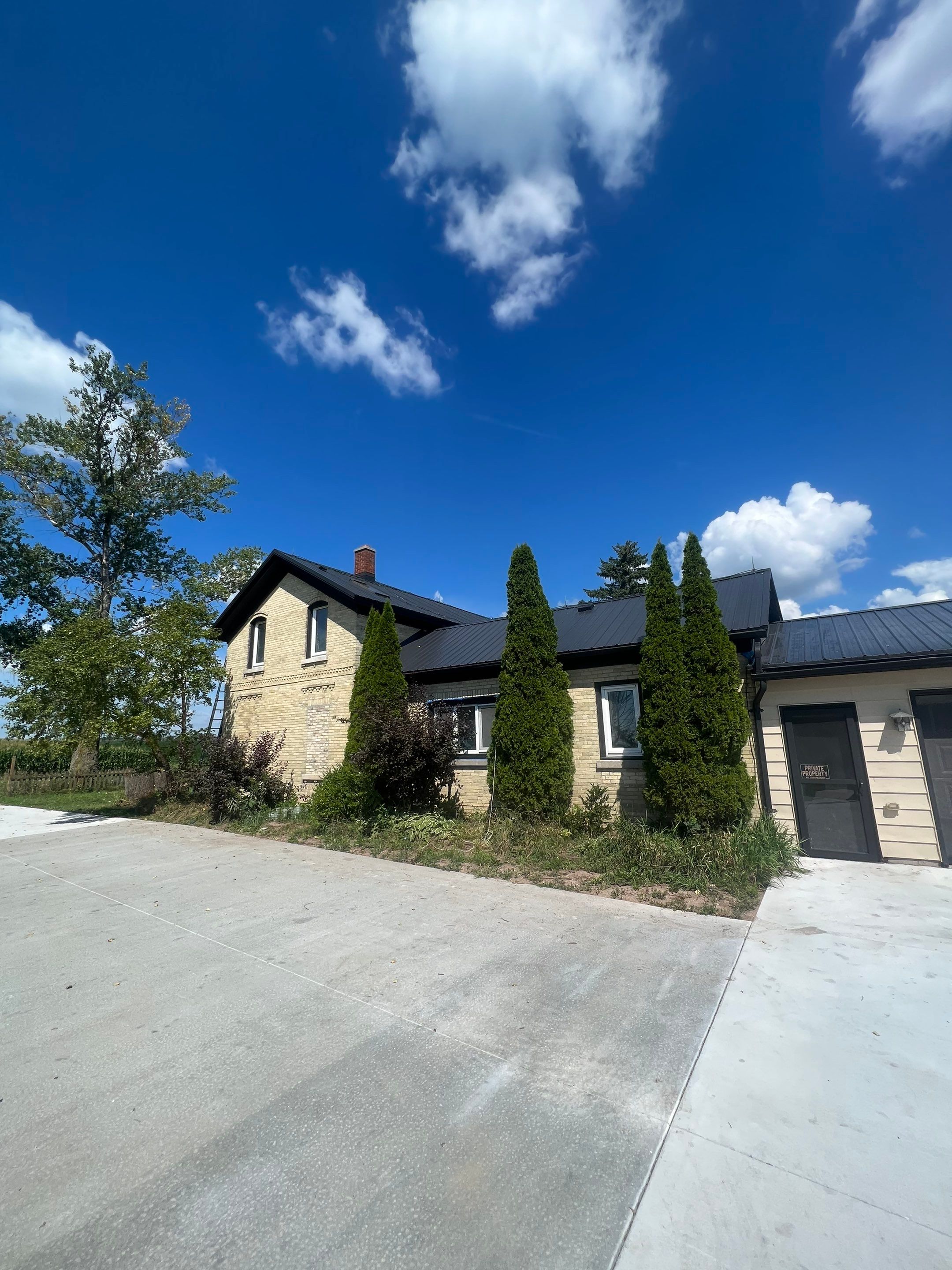  Metal Roof Installation on Residential Brick Home in Oostburg, WI by Gellings Roofing & Siding