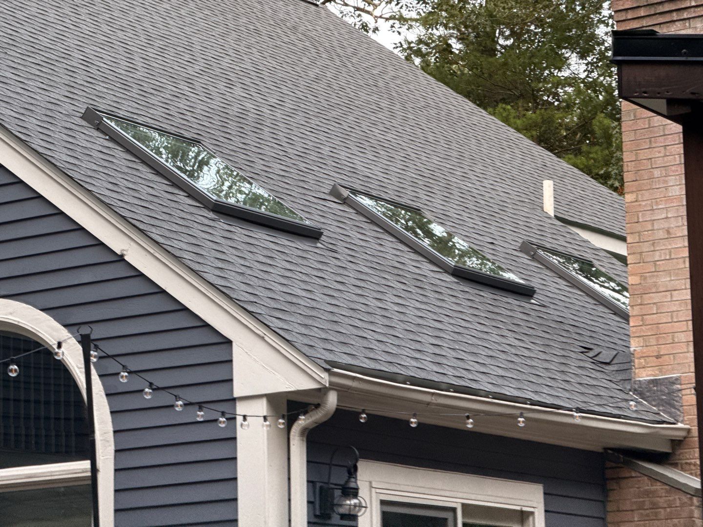 Solar-Ready Roof Replacement with GAF Pewter Gray Shingles & VELUX Skylights by Sensible Home Solutions