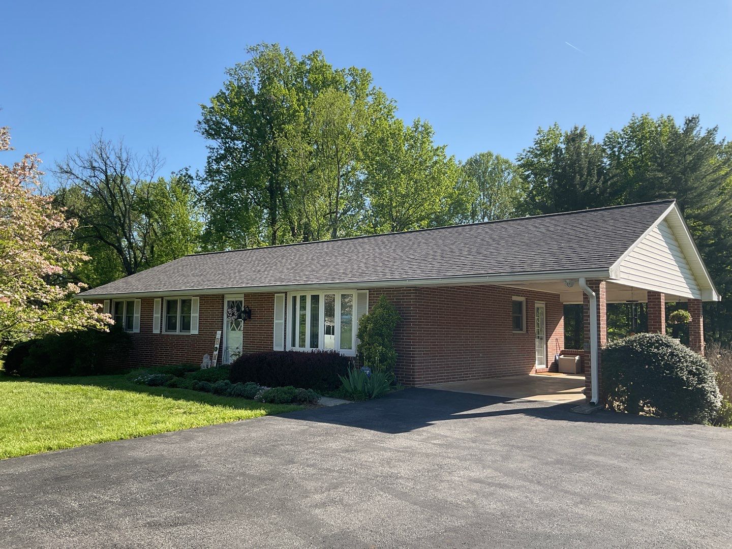 Residential Roofing Installation using Landmark Shingles Color Weatherwood by Alpha Design Services