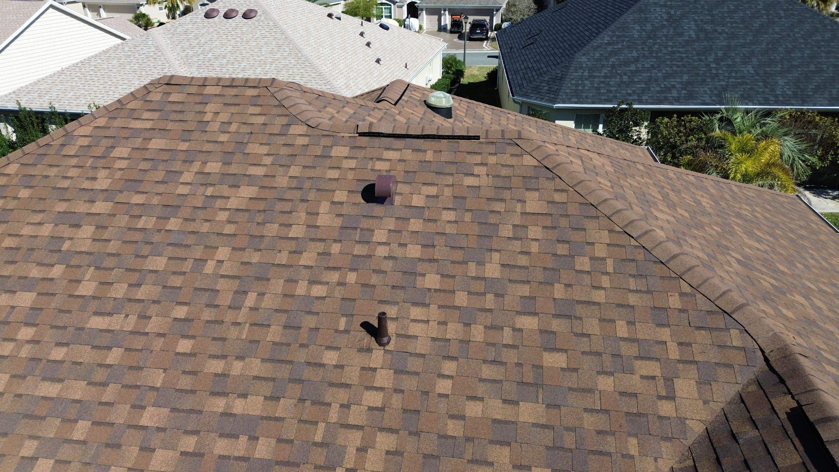 Florida roofers installing shingles by Brehm Roofing