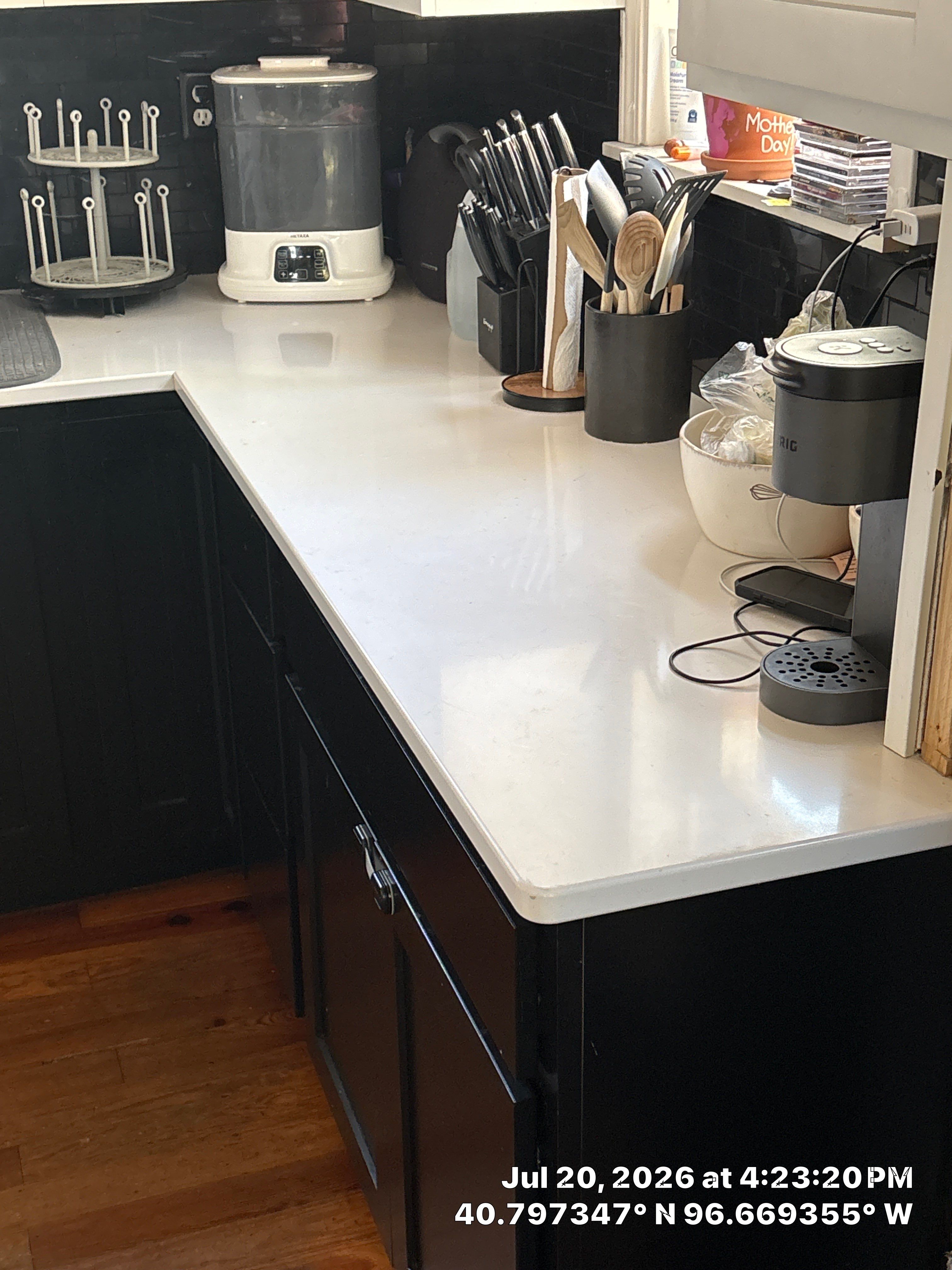 Kitchen Remodel in Lincoln Nebraska Featuring Two-Tone Cabinetry and Black Backsplash by CompanyCam Sales Demo