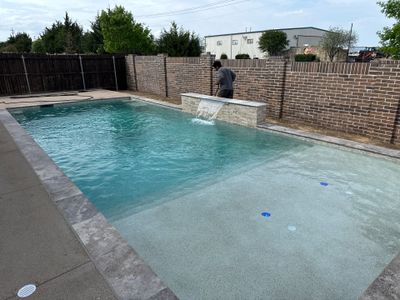 Rectangular Pool with Tanning Ledge and Waterfall