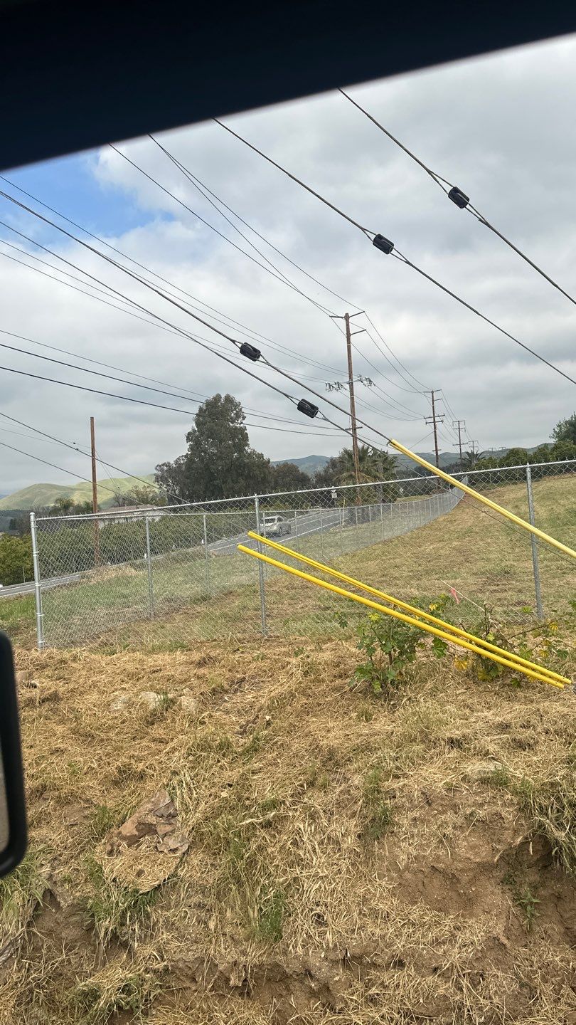 Fence installation using chain link wire by Fence Guys Inc. 