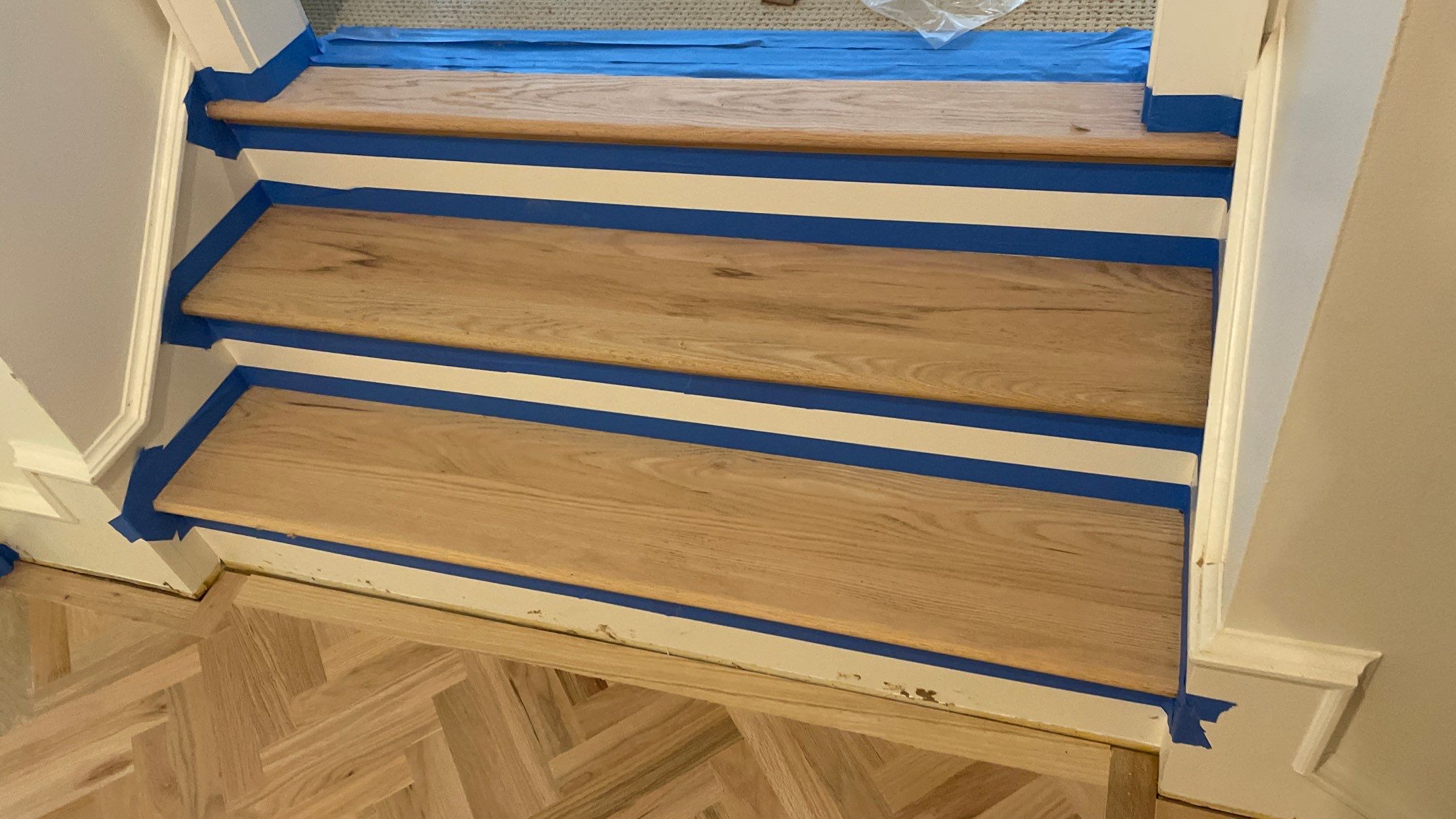 Herringbone Wood Hallway and Rooms by Footprints Floors of Coastal Carolina