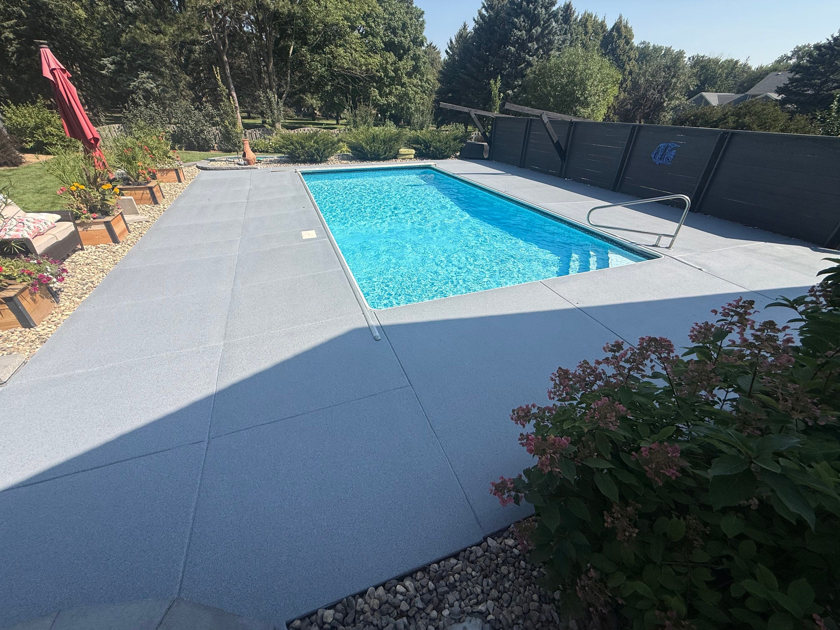 Garage Floor and Textured Pool Deck Coating in Sioux Falls by Select Painting, Coatings & Garage Cabinets