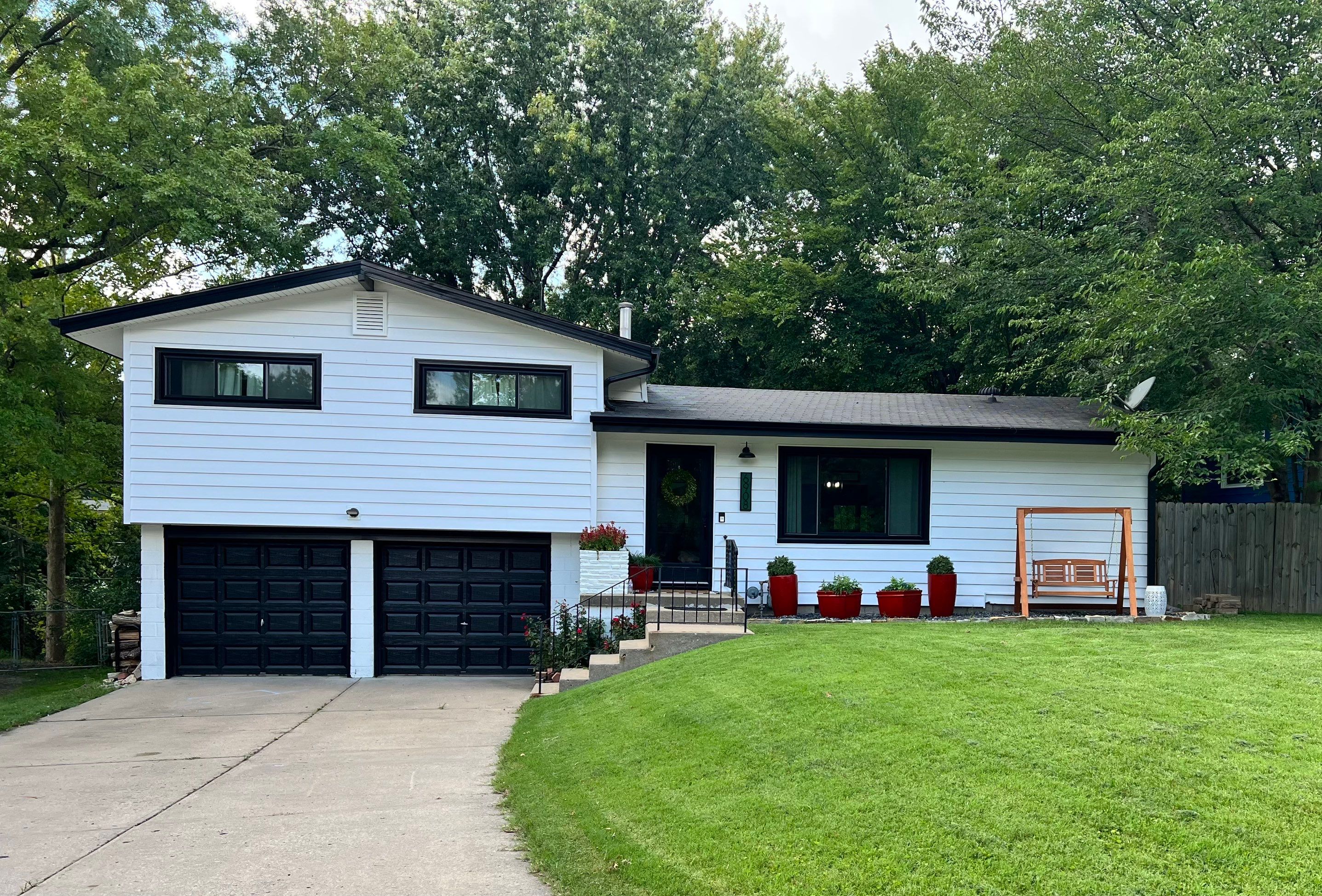 White Craneboard Siding and Heartland Window Installation in Parkville by EEC Windows, Siding & Roofing