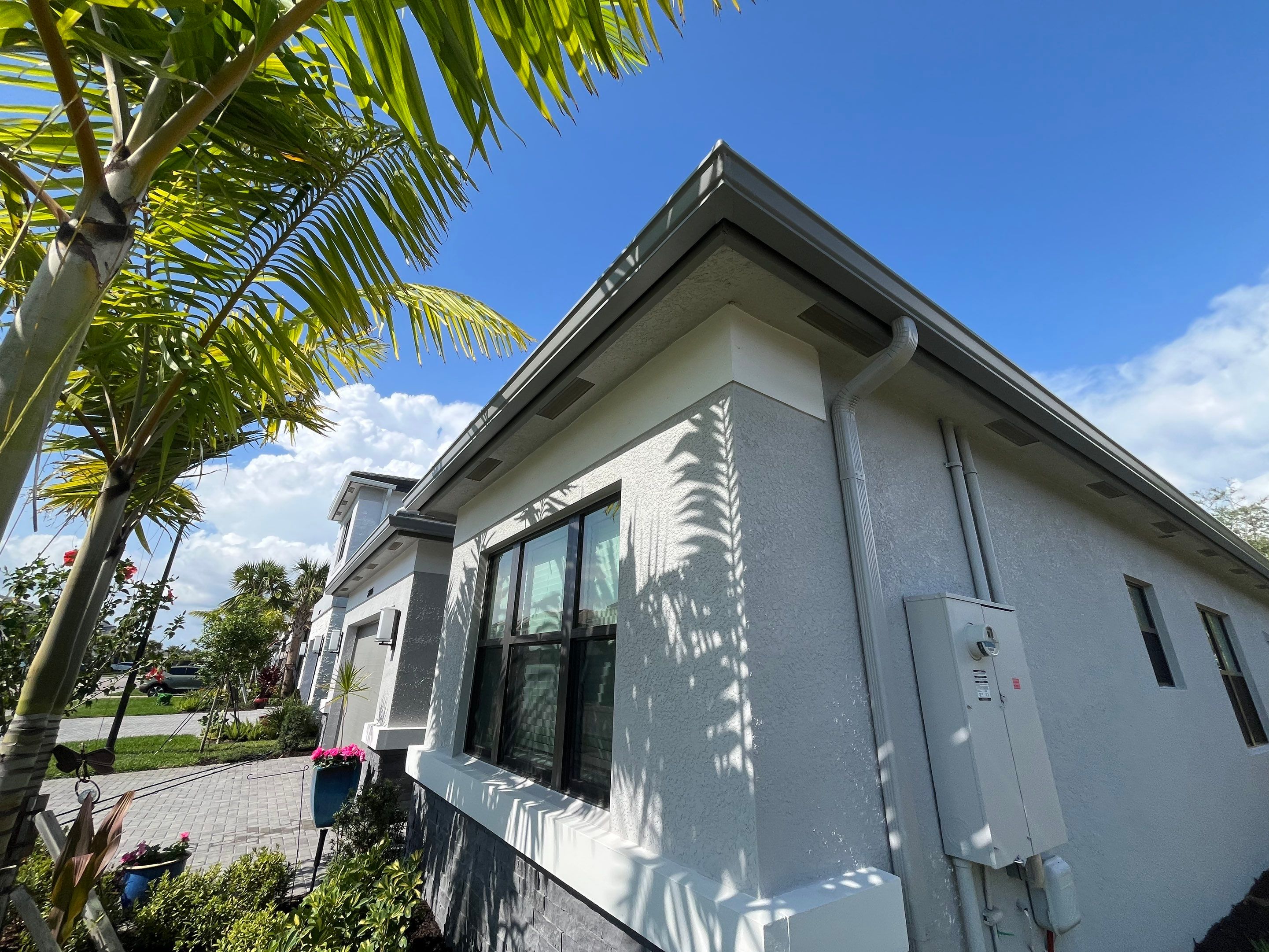 Grey Seamless Gutter Installation in Estero FL by Gutter Professors