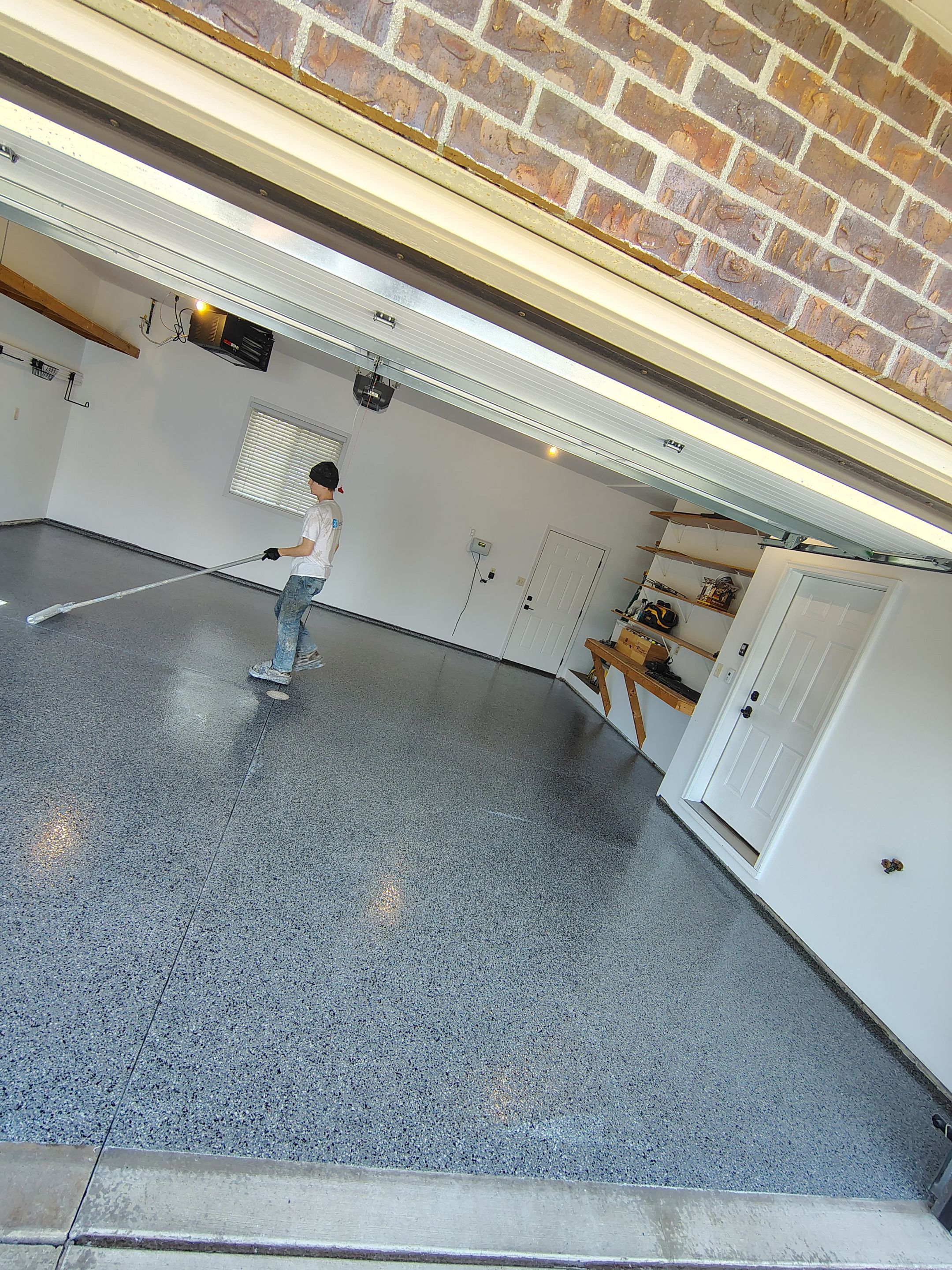 Grey Speckled Epoxy Garage Floor Coating in Sioux Falls by Select Painting, Coatings & Garage Cabinets