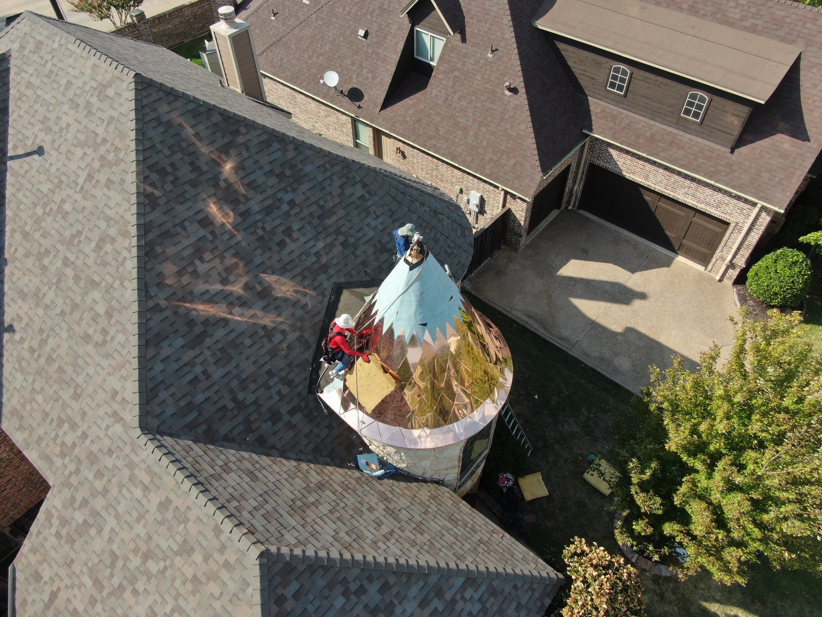Installing Custom copper turret and Malarkey Vista Class 4 shingles Hail Damage Upgrade by Becker Roofing and Exteriors
