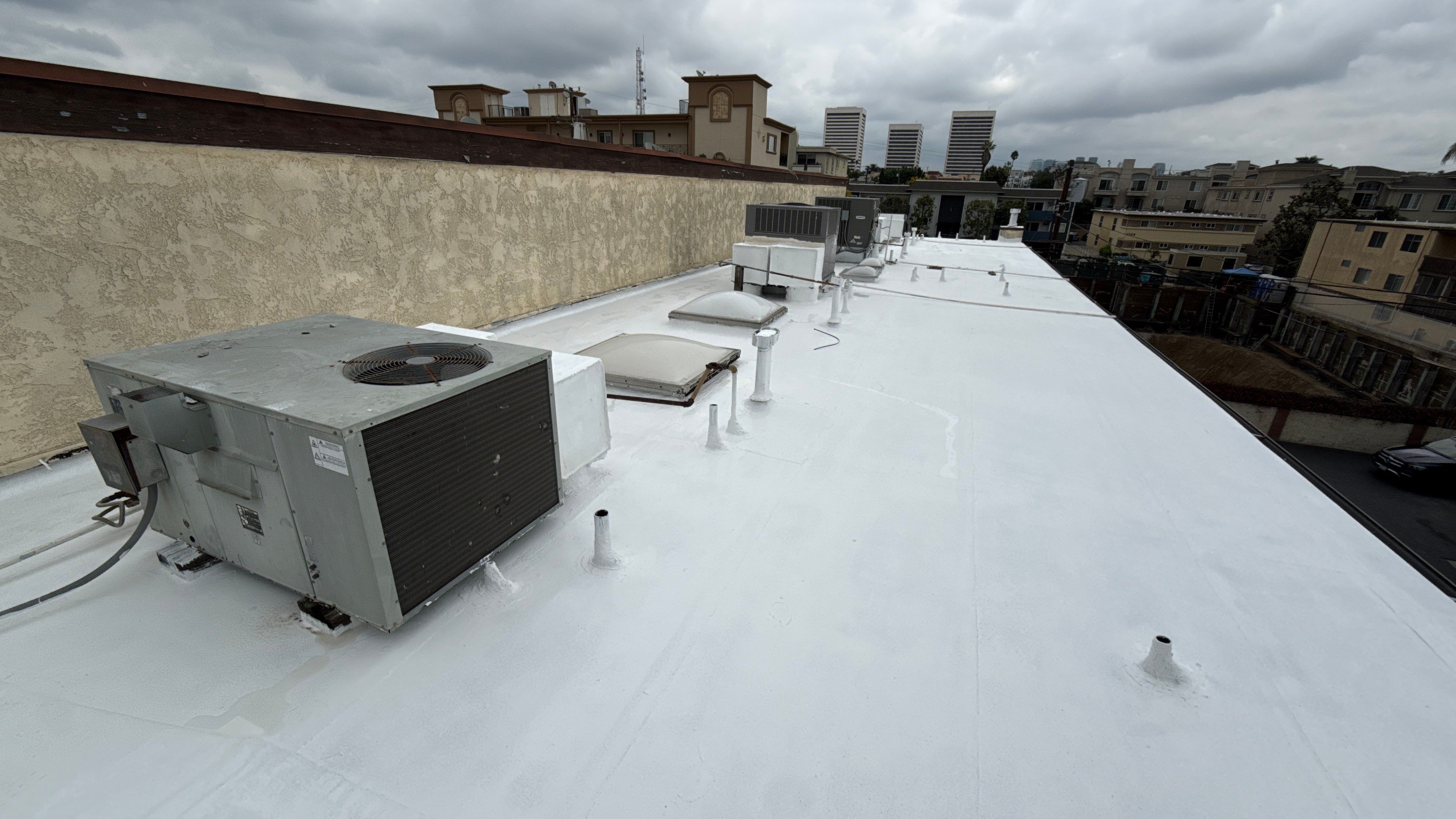 Apartment Building Silicone Coating by Hull Brothers Roofing