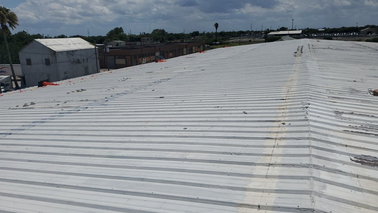 Commercial Roofing Installation using GAF 10 Year Acrylic System by Lighthouse Roofing