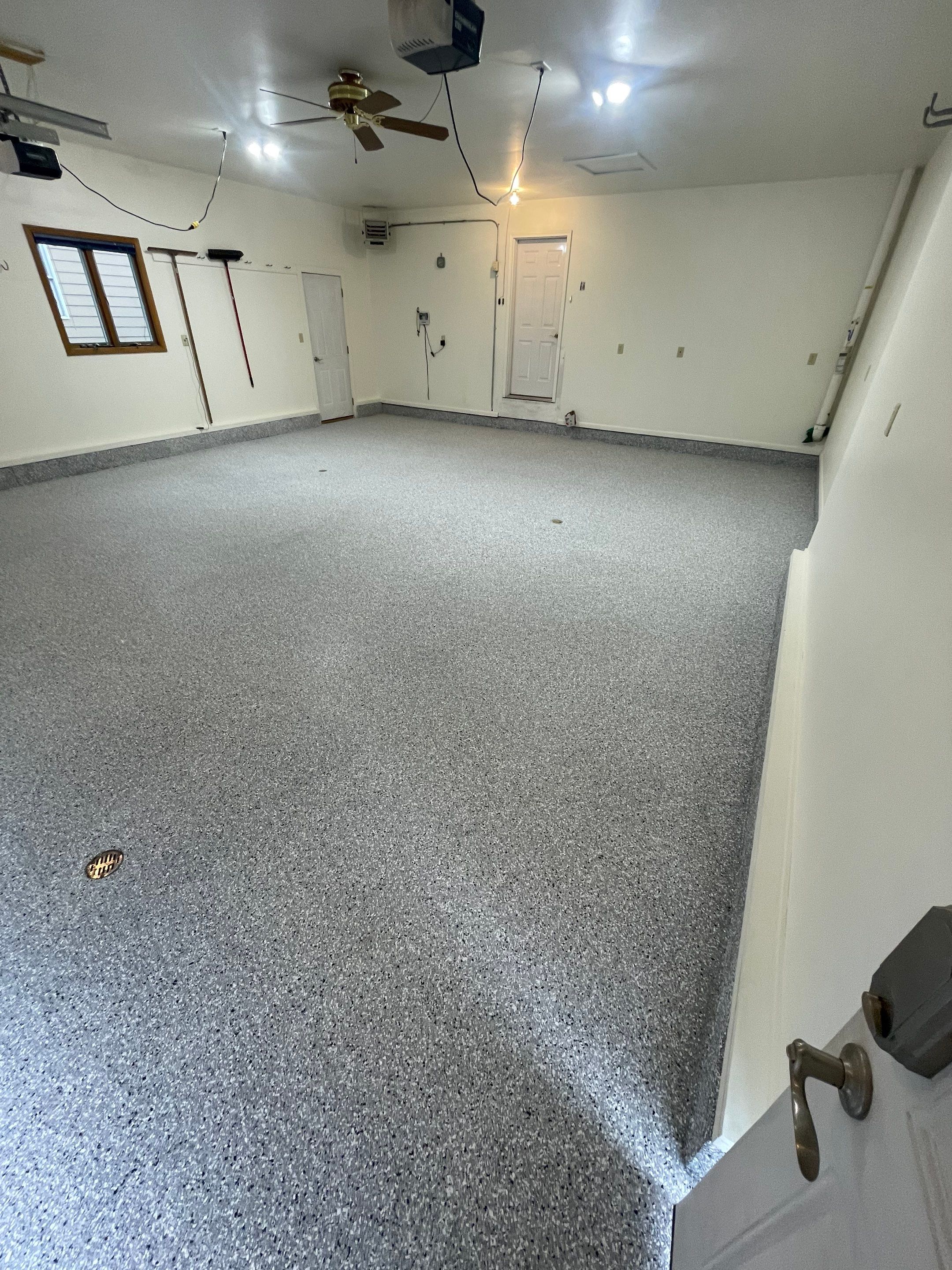 Madison Garage Concrete Coating with Feather Grey Speckle Finish by Select Painting, Coatings & Garage Cabinets