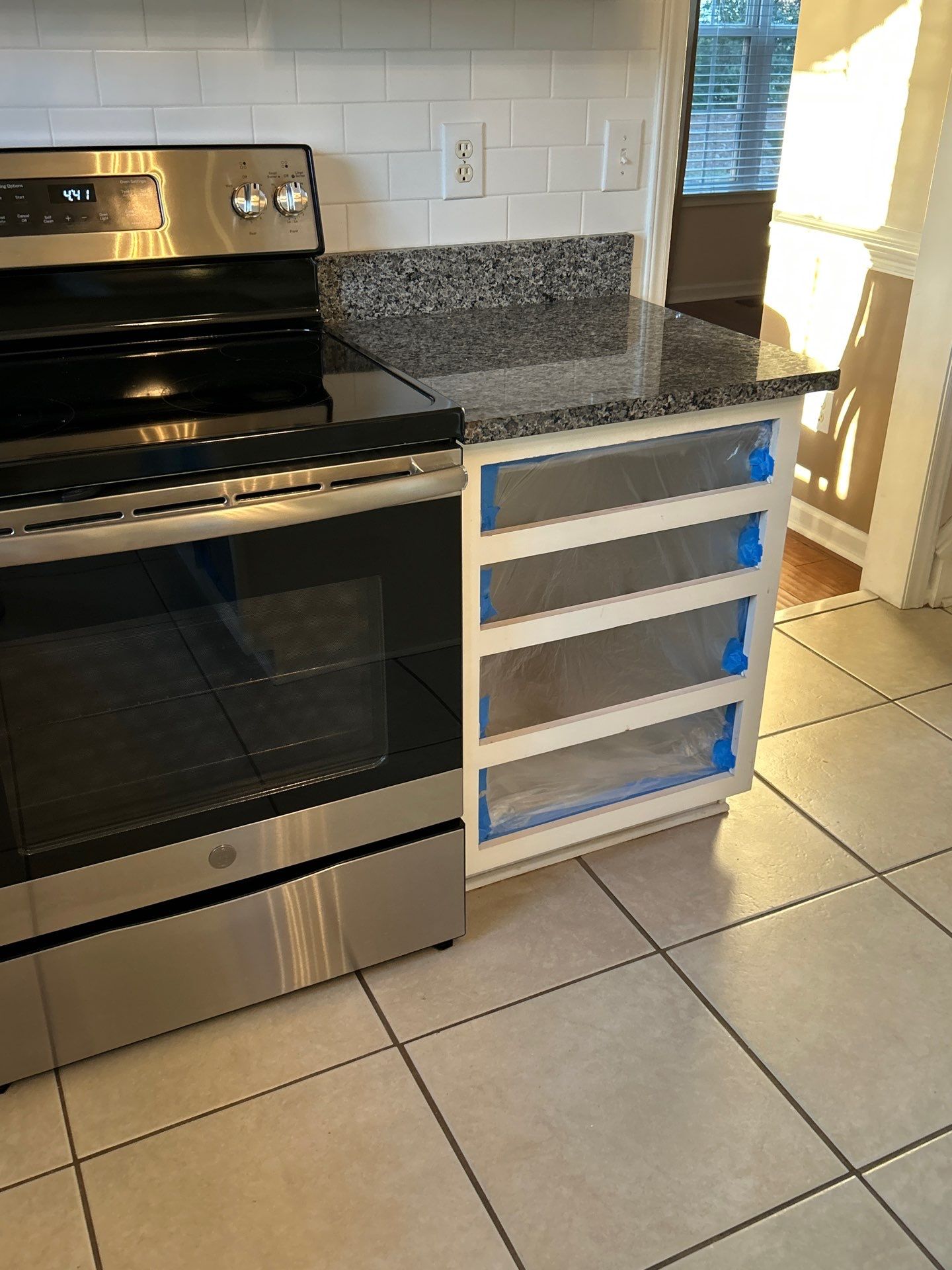 Cabinet painting by GonzalezPainters & Contractors Inc 