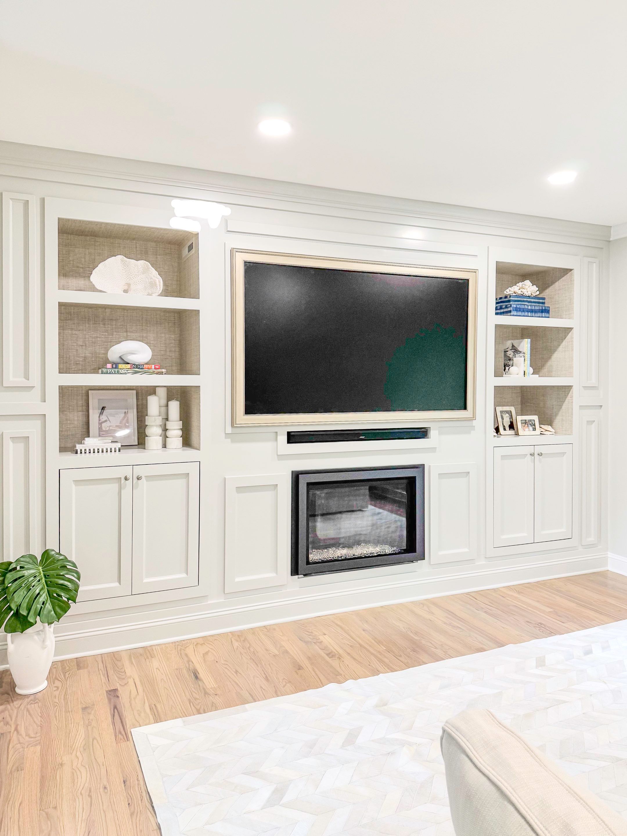Built-in TV unit by Trendy Walls Inc.