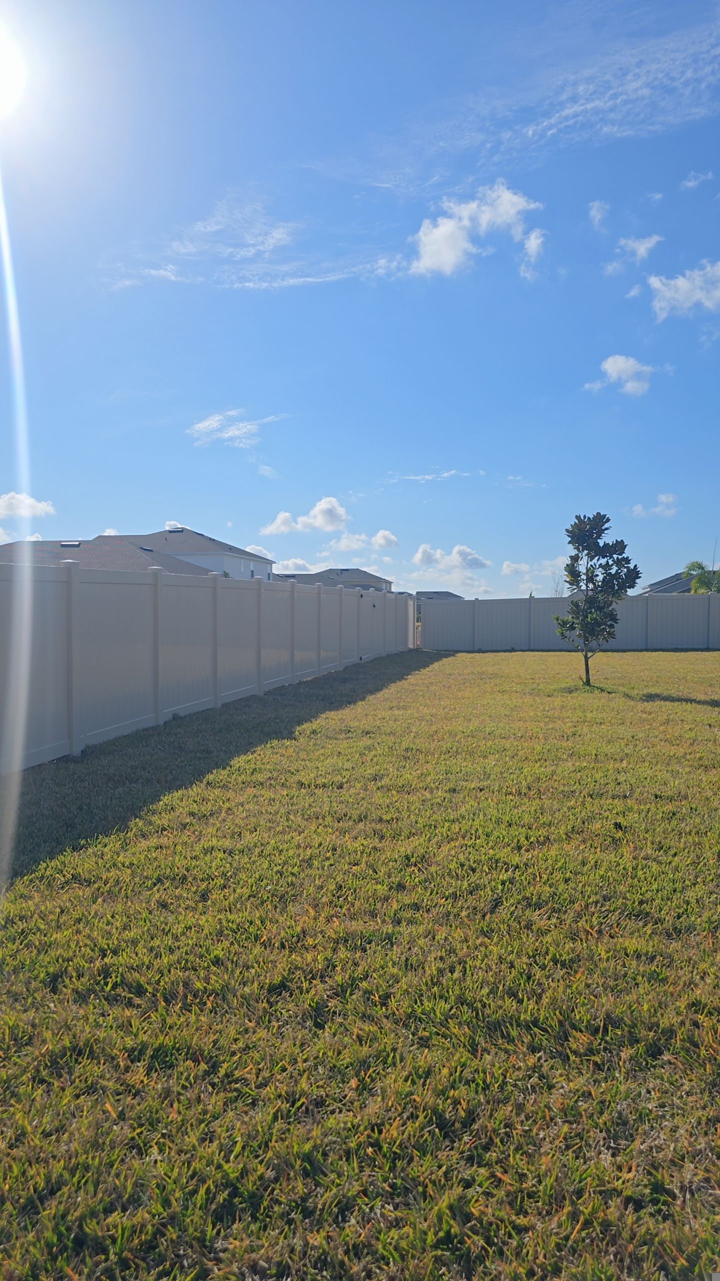 Tan Vinyl Fence in West Port by True Fence LLC