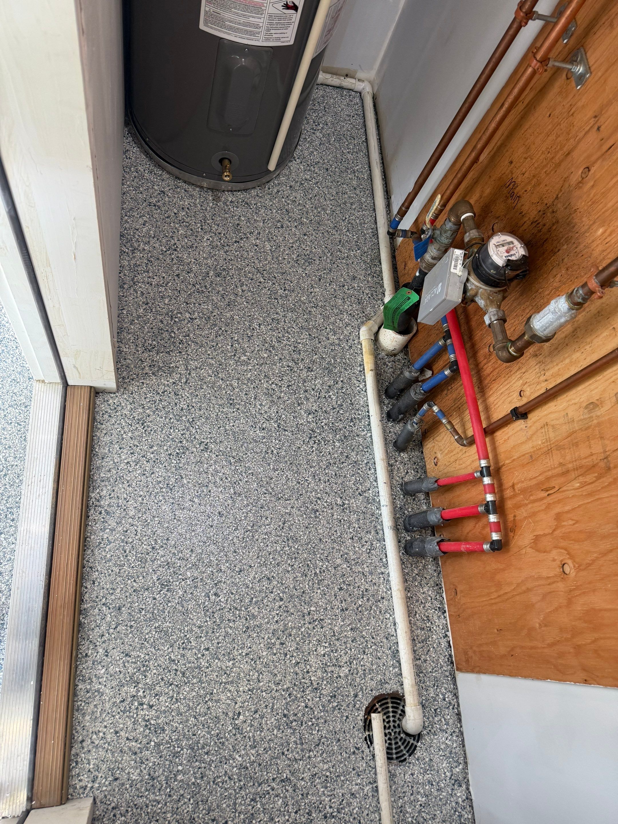 Decorative Chip Epoxy Floor Coating Installation in Sioux Falls by Select Painting, Coatings & Garage Cabinets