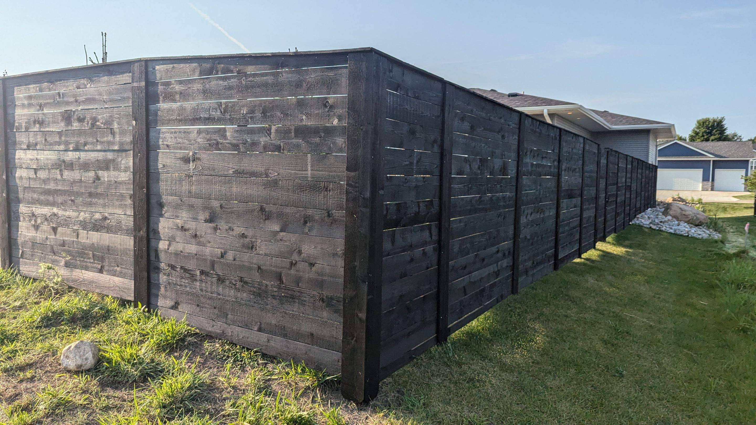 Modern Black Stained Horizontal Privacy Fence Installation in Cedar by Perfect Picket Fence and Stain