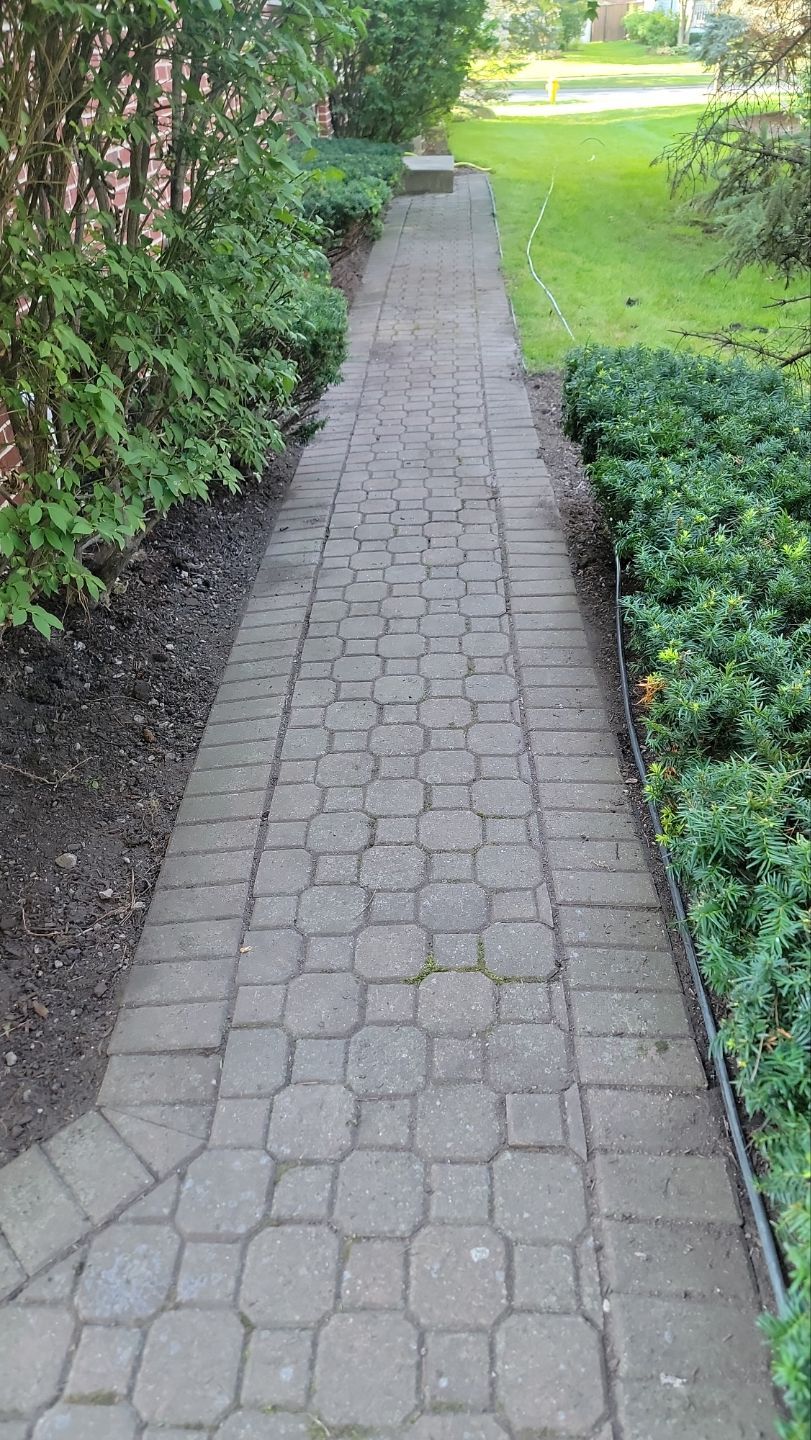 Brick paver repair, clean and seal by Northern Power Washing LLC.