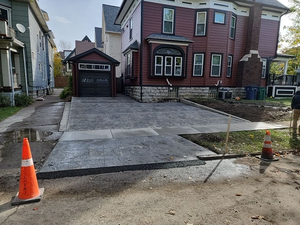 Exterior Renovations- Siding, Stamped Concrete, Porch, and Railings by Ivy Lea Construction