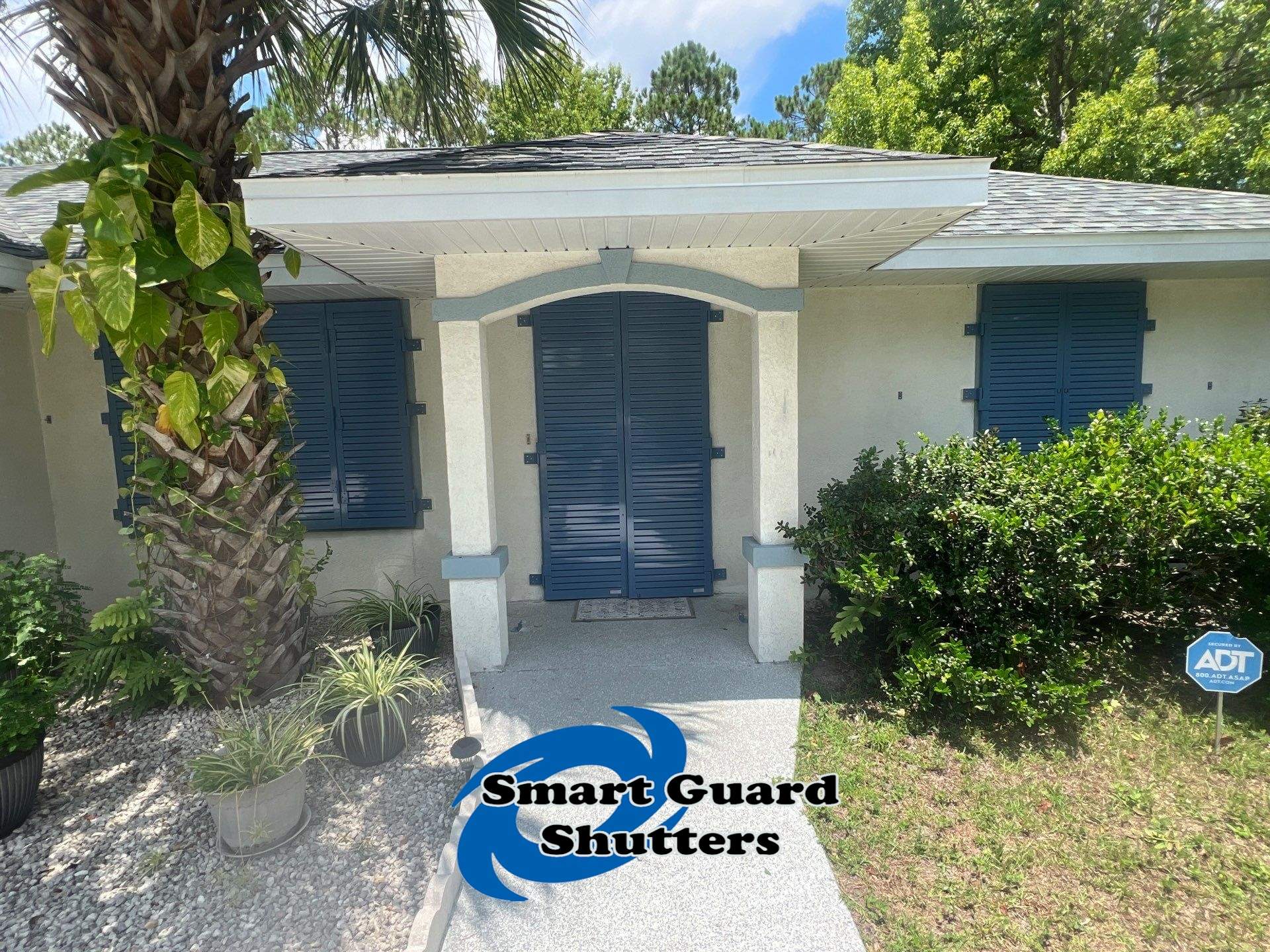 Impact Rated Colonial Shutters in Pigeon Blue by Smart Guard Shutters