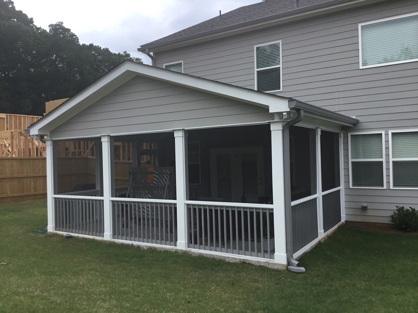Screened Porch Addition With Gabled Roof and Tongue and Groove Ceiling by Swift Home Renovations