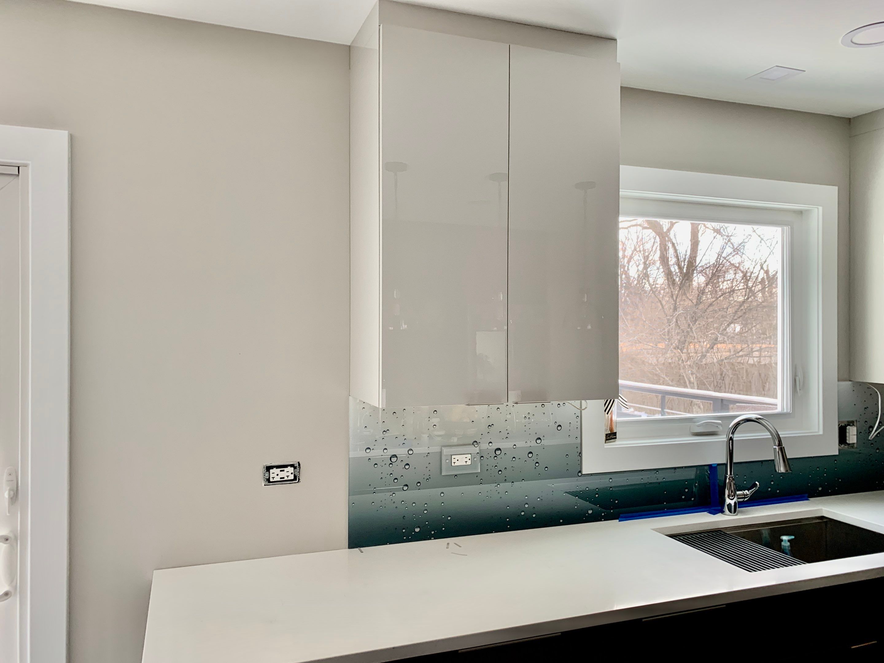 Let It Rain Kitchen Remodel using IMAGIO Solid Glass Backsplash by IMAGIO