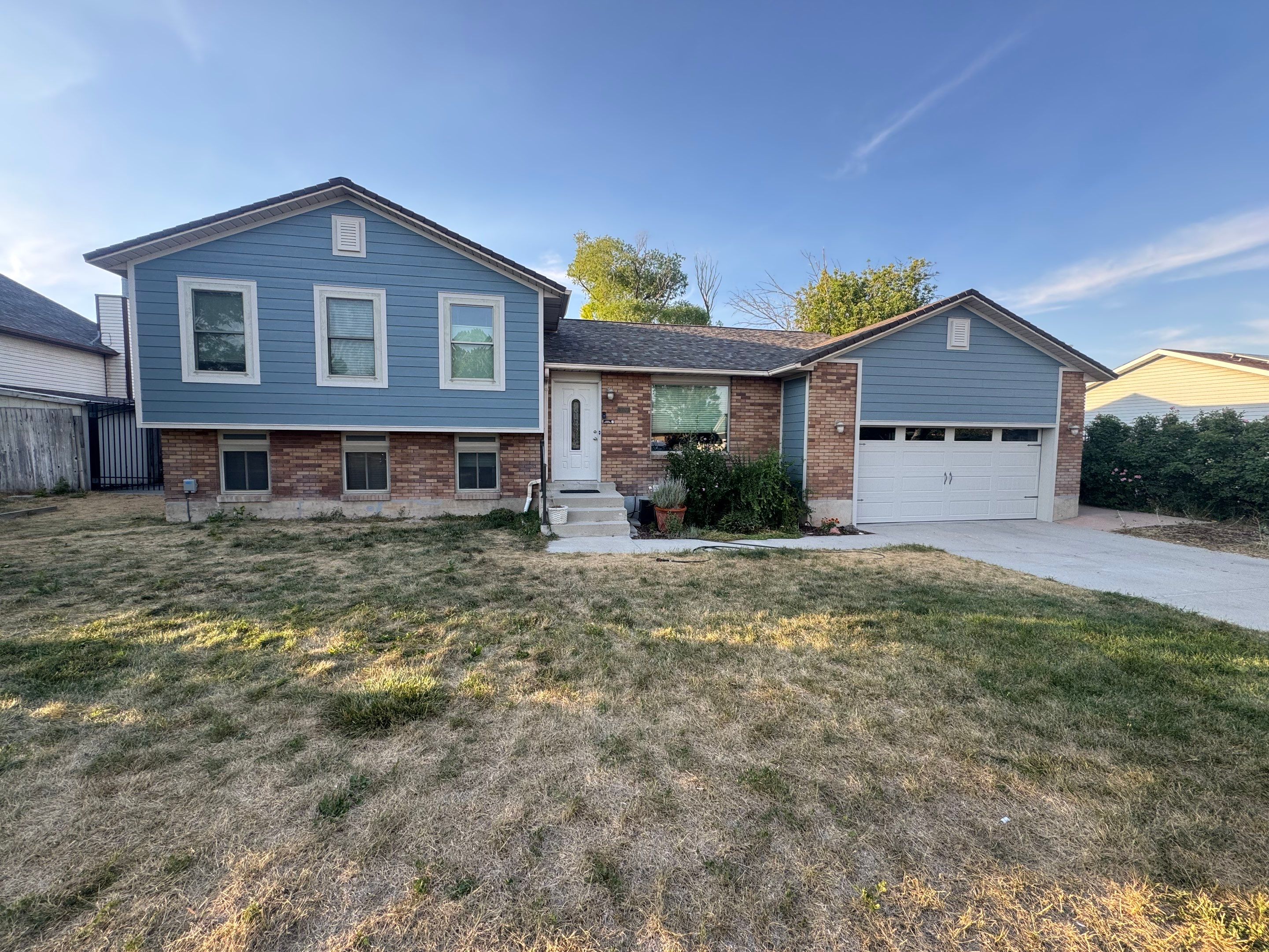West Jordan | Hardie Lap Siding w/ Brick Accent | Boothbay Blue & Cobble Stone by Ideal Siding Utah