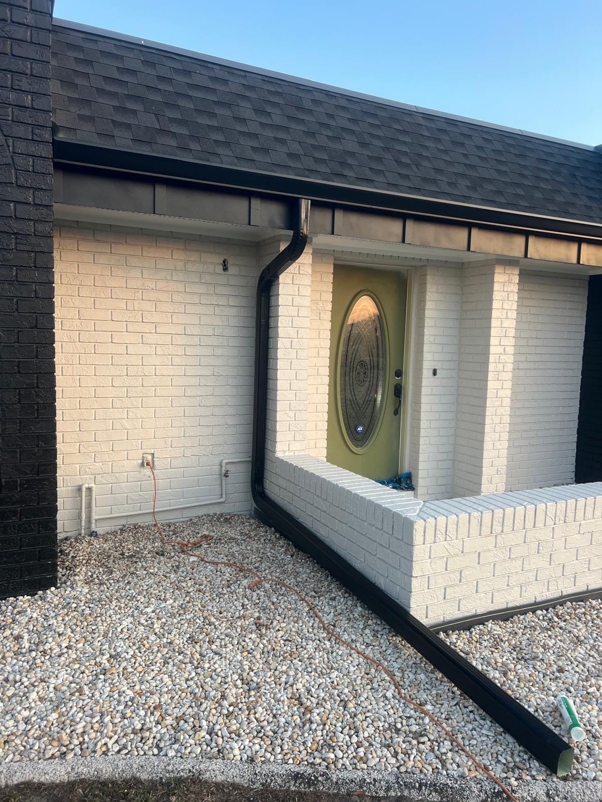 Black 6'' Seamless Gutters K-Style and Black Downspouts in Sun City Center FL by Gutter Professors