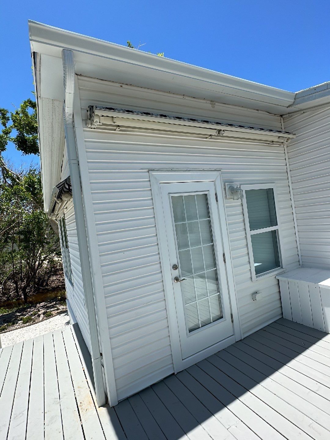 Downspout Installation using Charcoal Grey in Sanibel FL by Gutter Professors