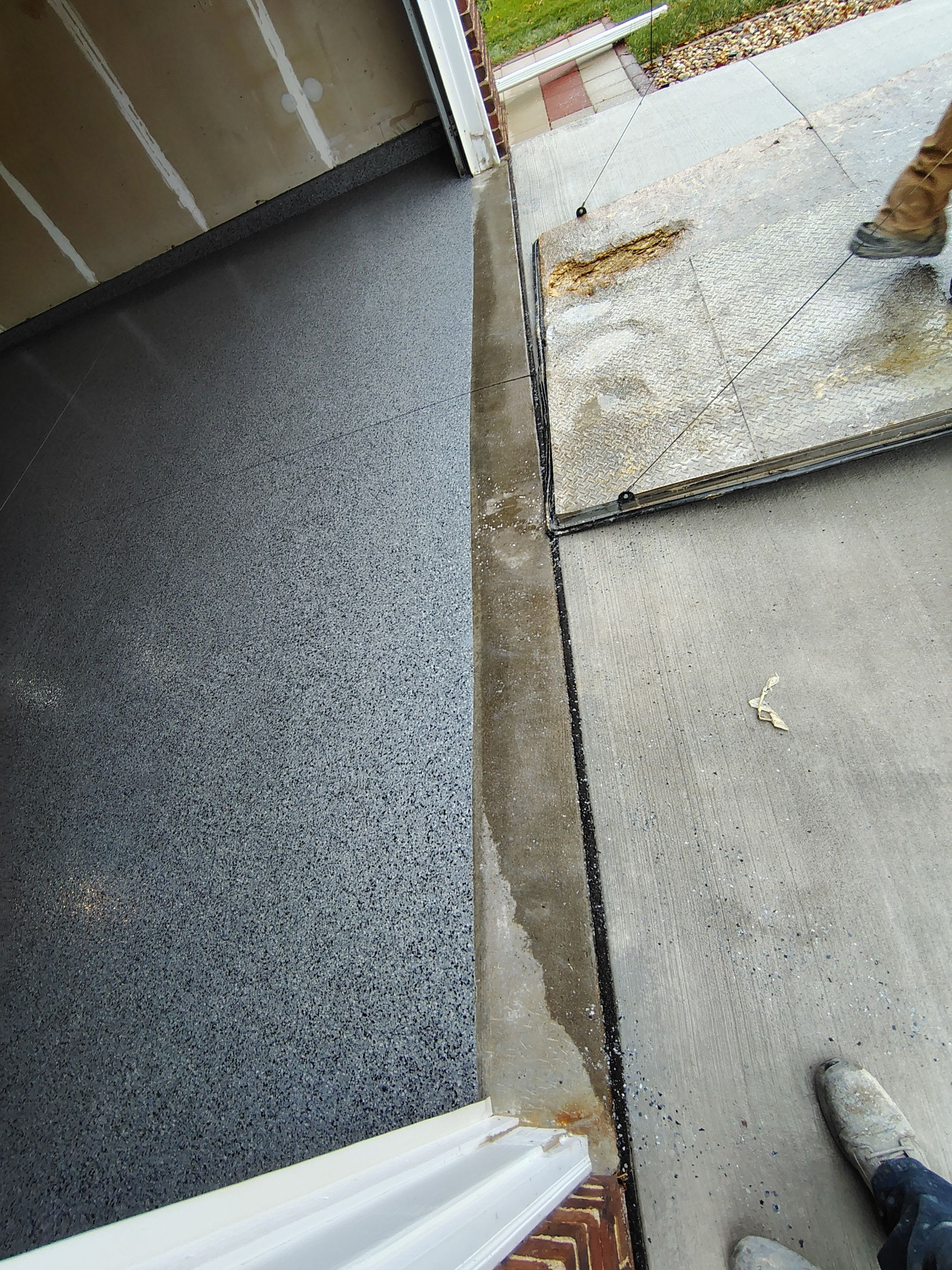 Nightfall Grey Speckled Epoxy Garage Floor Coating in Sioux Falls by Select Painting, Coatings & Garage Cabinets