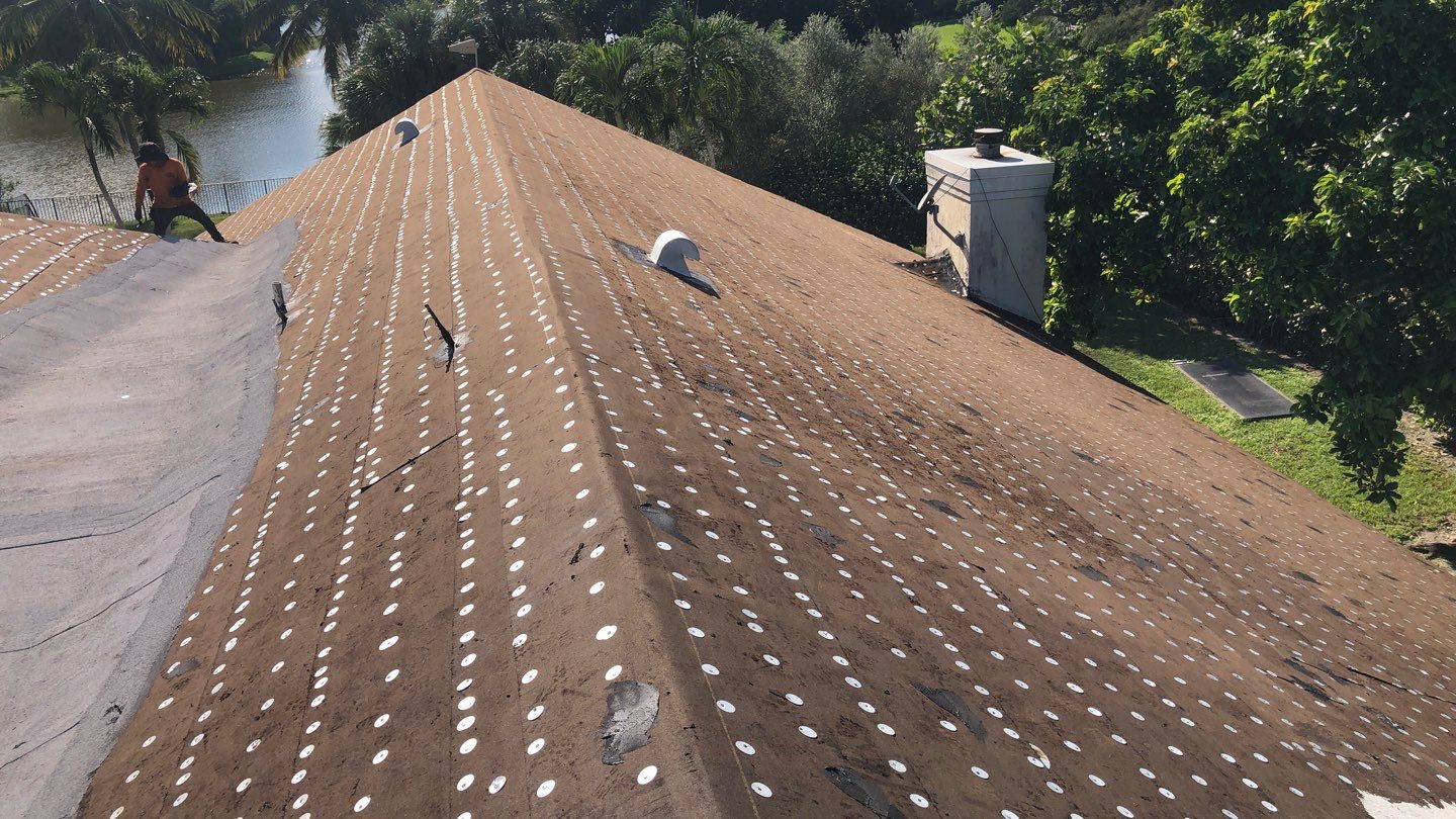 Residential Roofing Installation using 1" Nail strip metal roof by BLUES BROTHERS CONSTRUCTION CORP