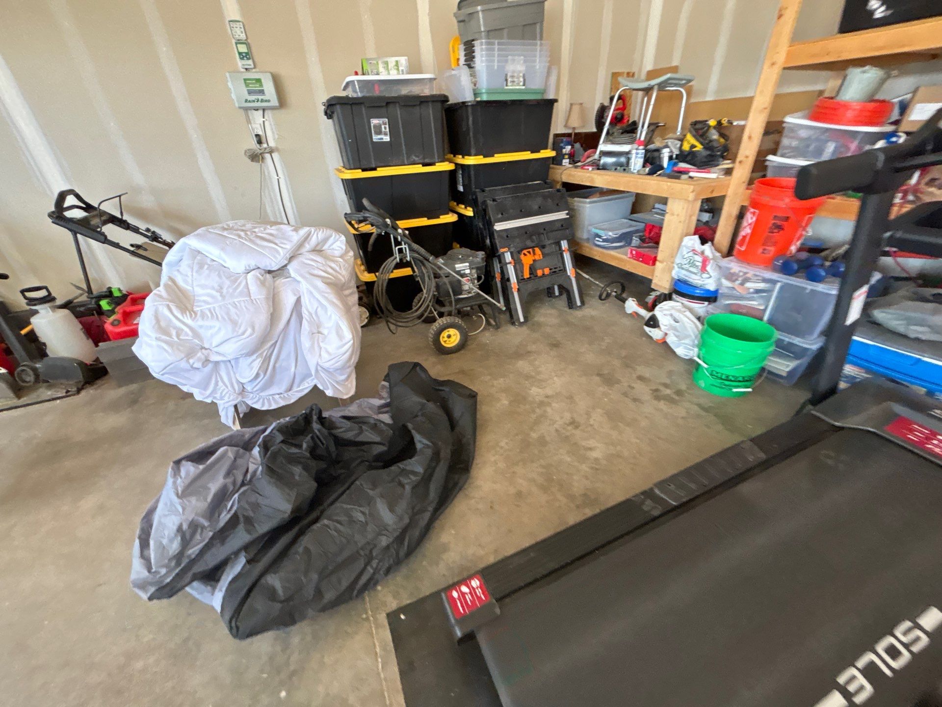 Grey Flake Epoxy Garage Floor Coating in Sioux Falls by Select Painting, Coatings & Garage Cabinets