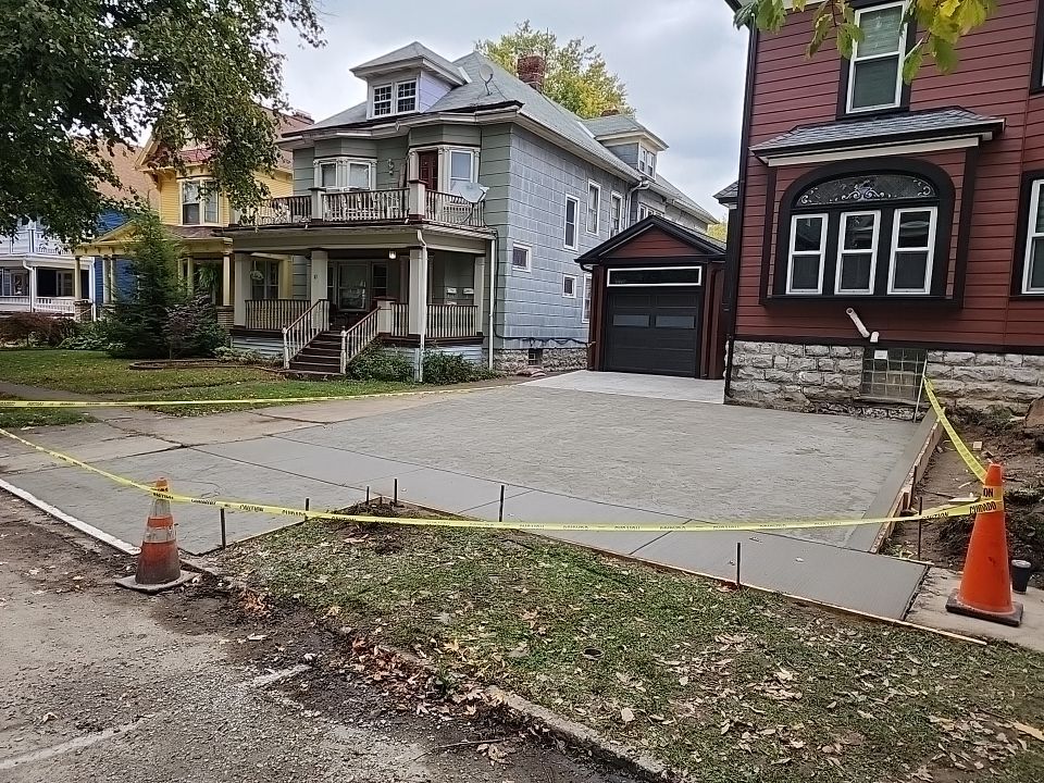 Exterior Renovations- Siding, Stamped Concrete, Porch, and Railings by Ivy Lea Construction