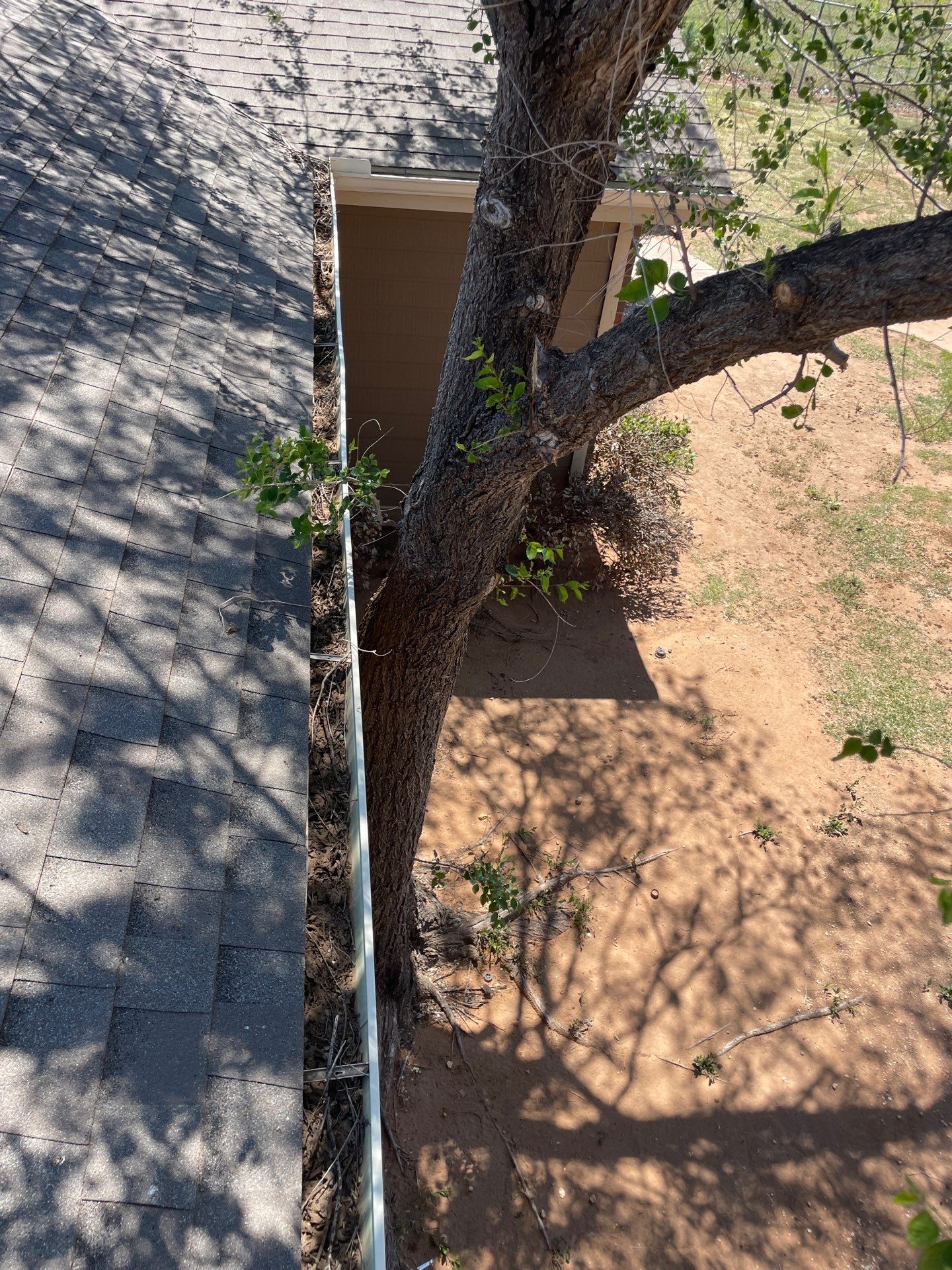 Commercial gutter cleaning Amarillo, TX before photo with filled gutters