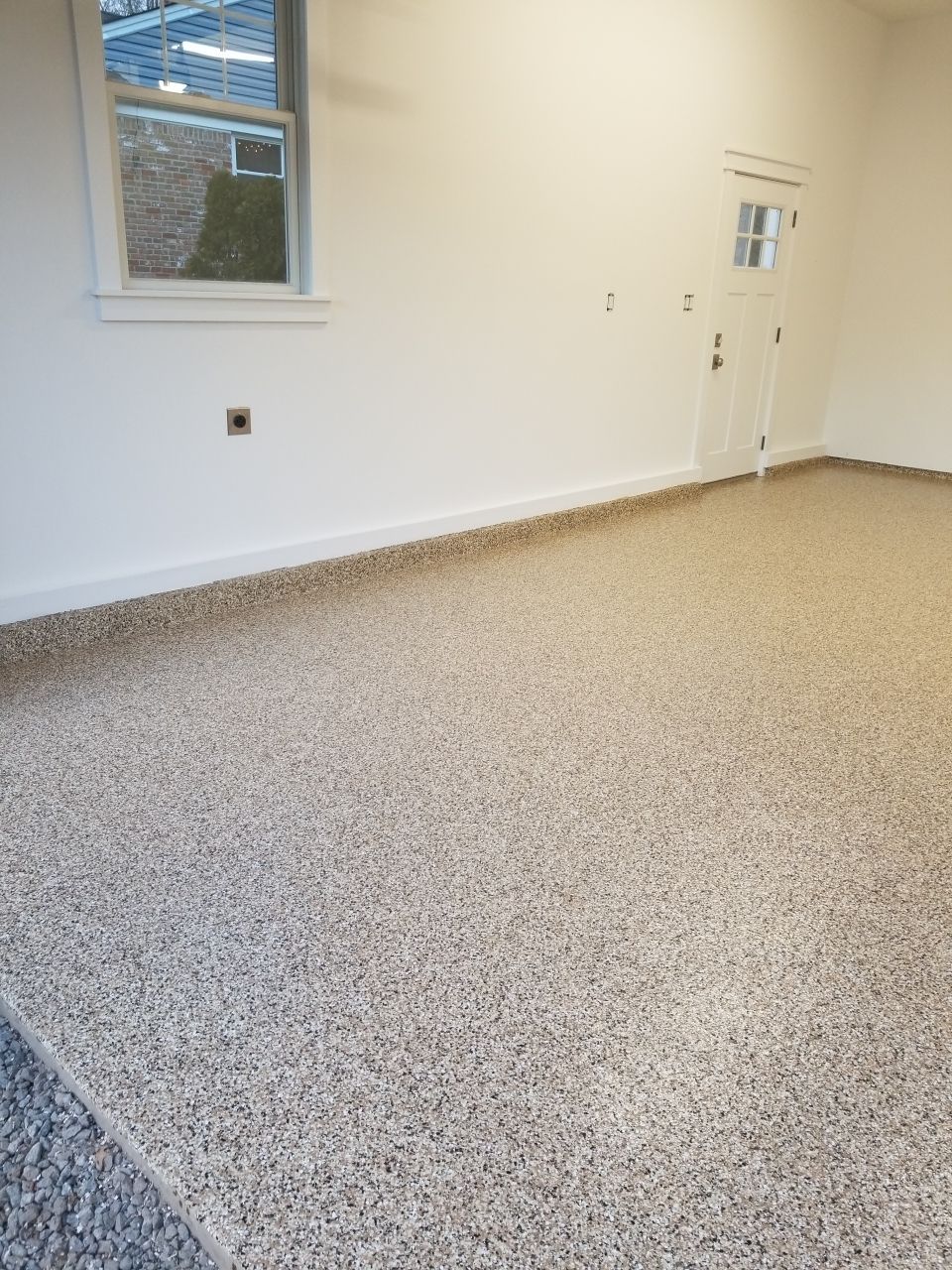 Garage Floor in Sandstone by Spectrum Painting, LLC