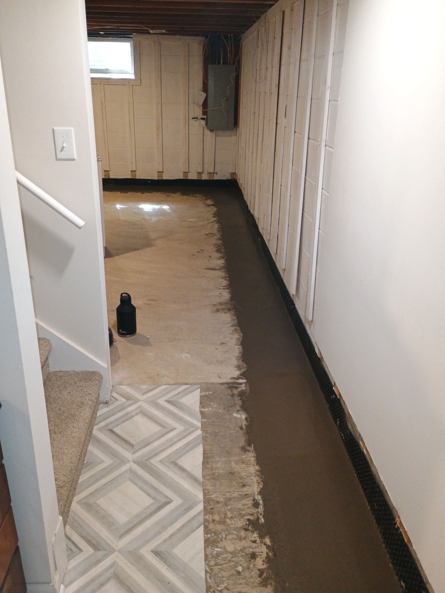 Interior Drain Tile & Buried Discharge in St. Anthony, MN by Waterproofing Northeast