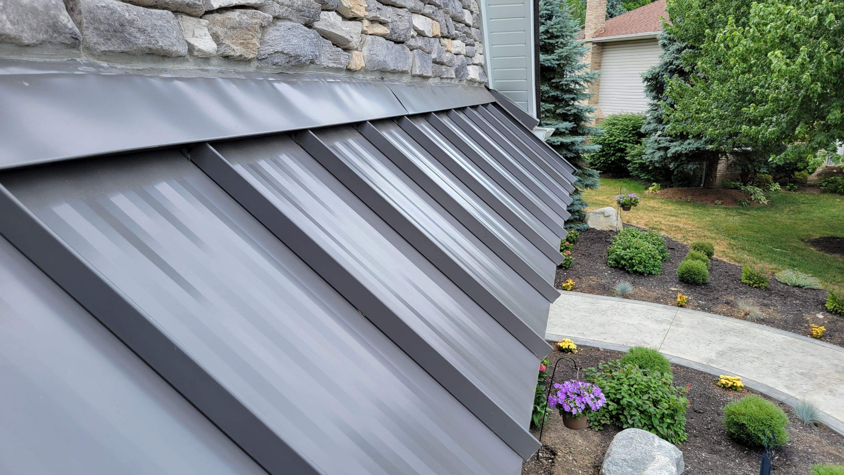 Garage Metal Roof using Standing Seam Metal by Absolute Roofing and Construction