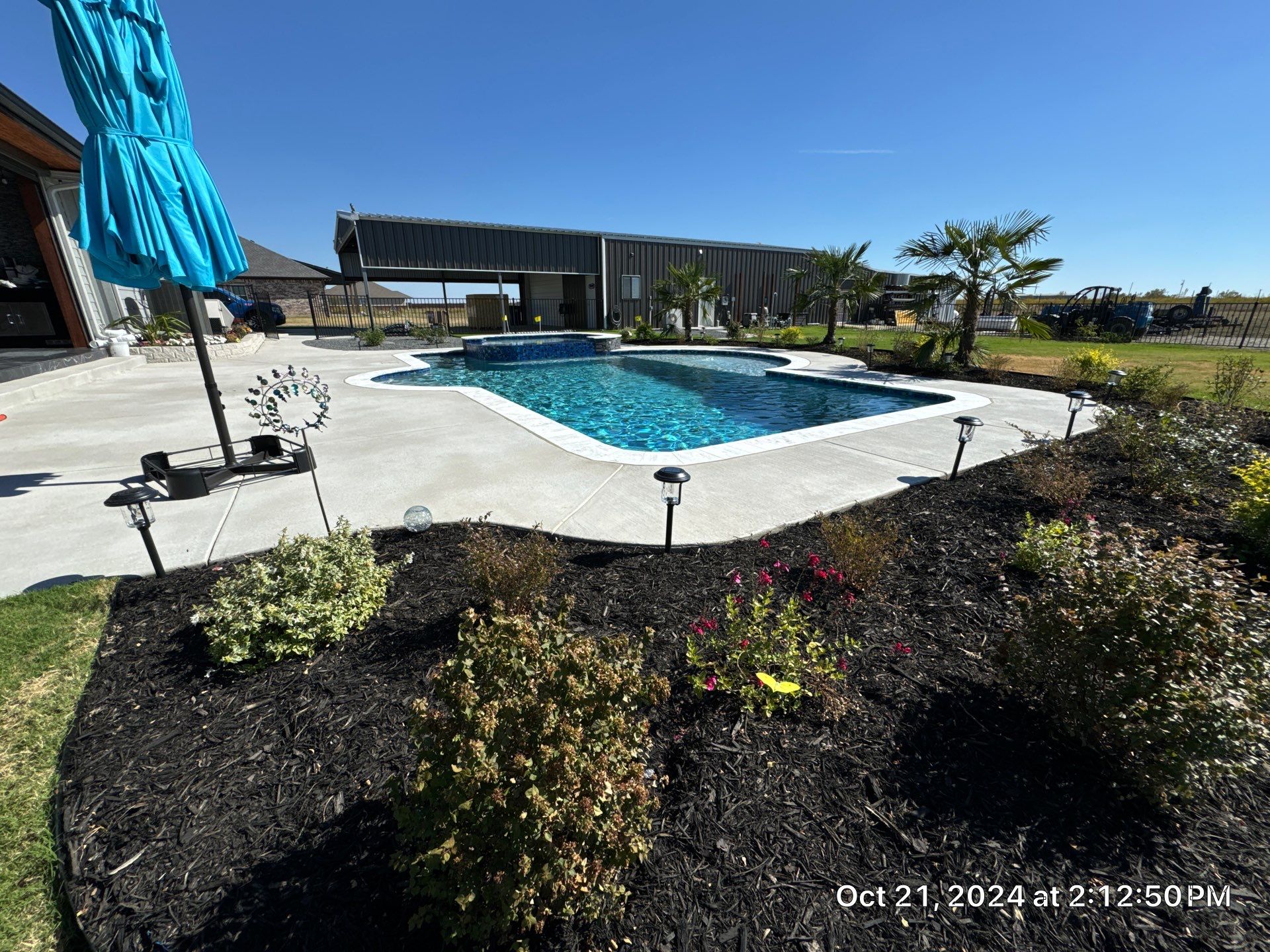 Freeform Pool with Raised Spa by Pinnacle Pools and Spas - DFW