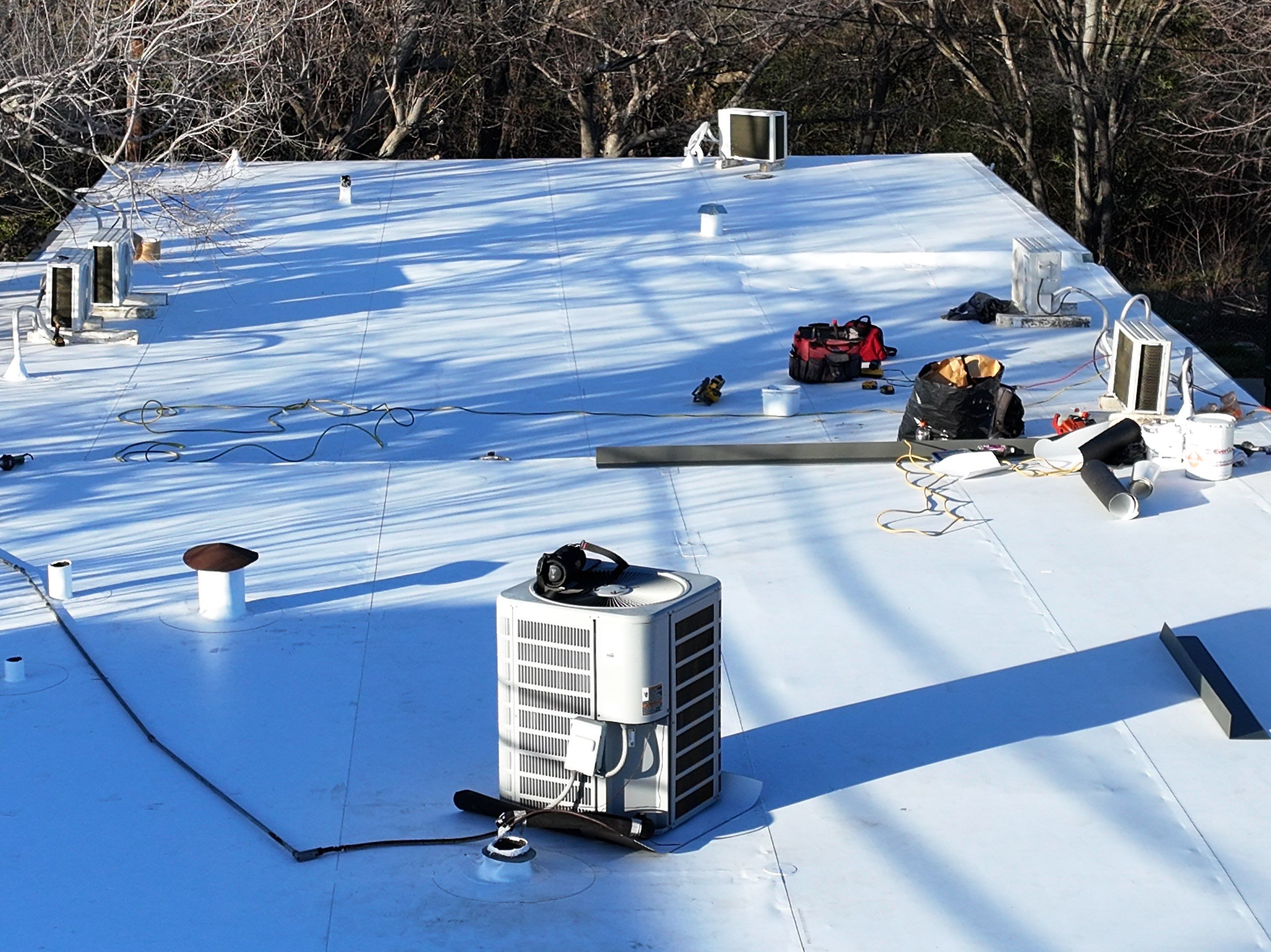Commercial roofing overlay using GAF TPO over an old ballast roof by Becker Roofing and Exteriors