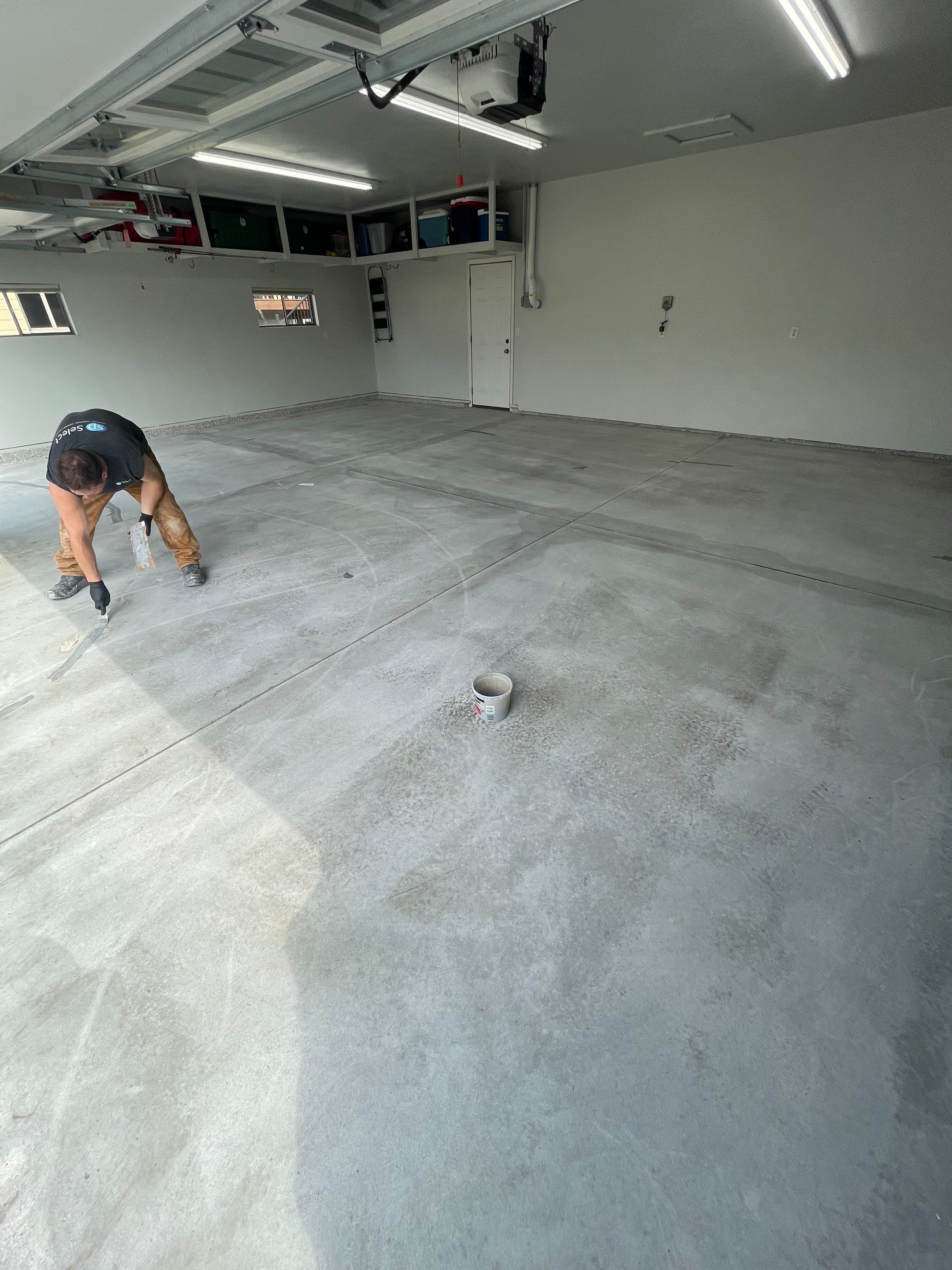 Multi-Car Garage Floor Coating and Crack Repair in Tea by Select Painting, Coatings & Garage Cabinets