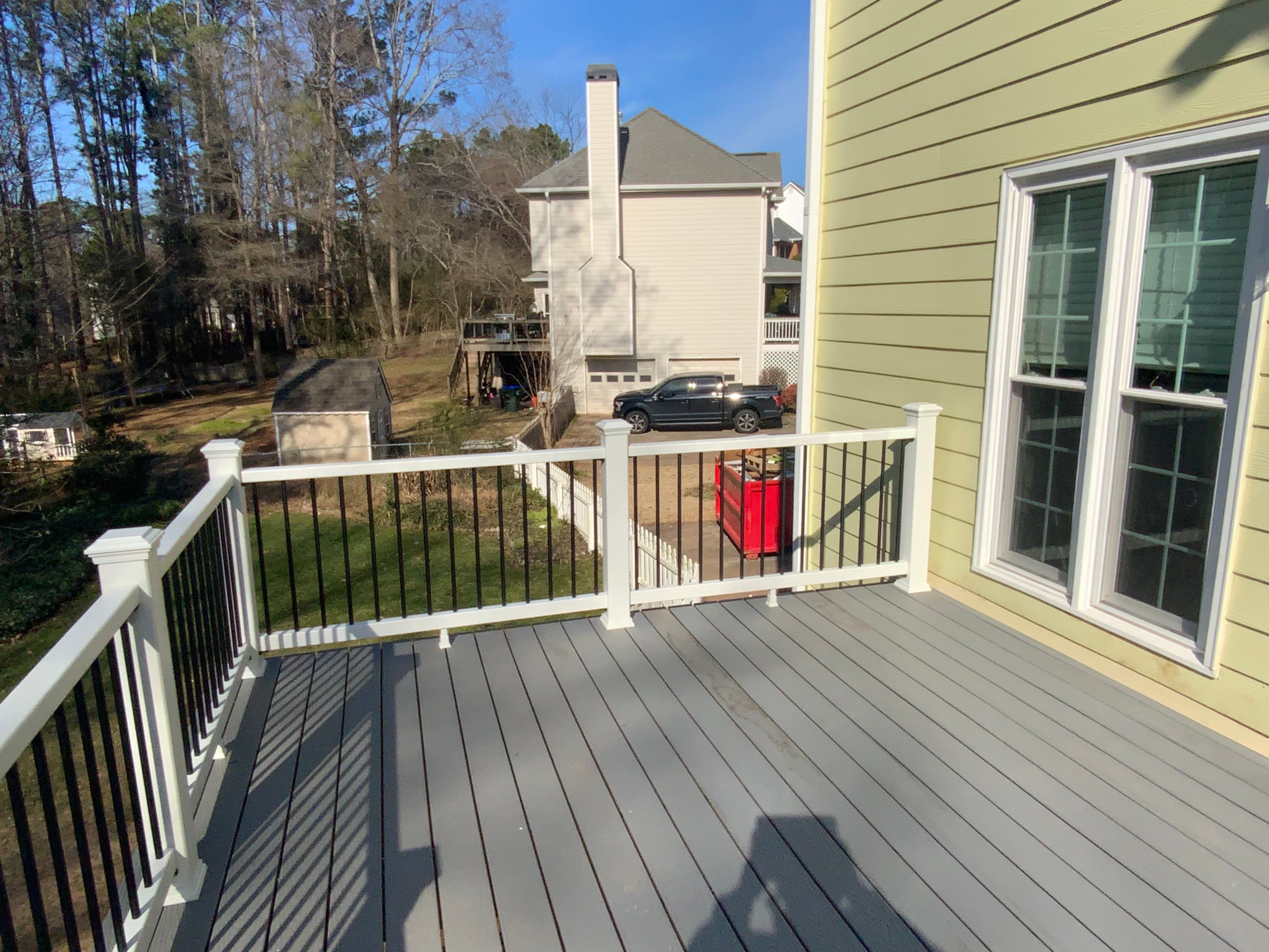Elevated Grey Composite Deck Installation in Woodstock, Georgia by Swift Home Renovations