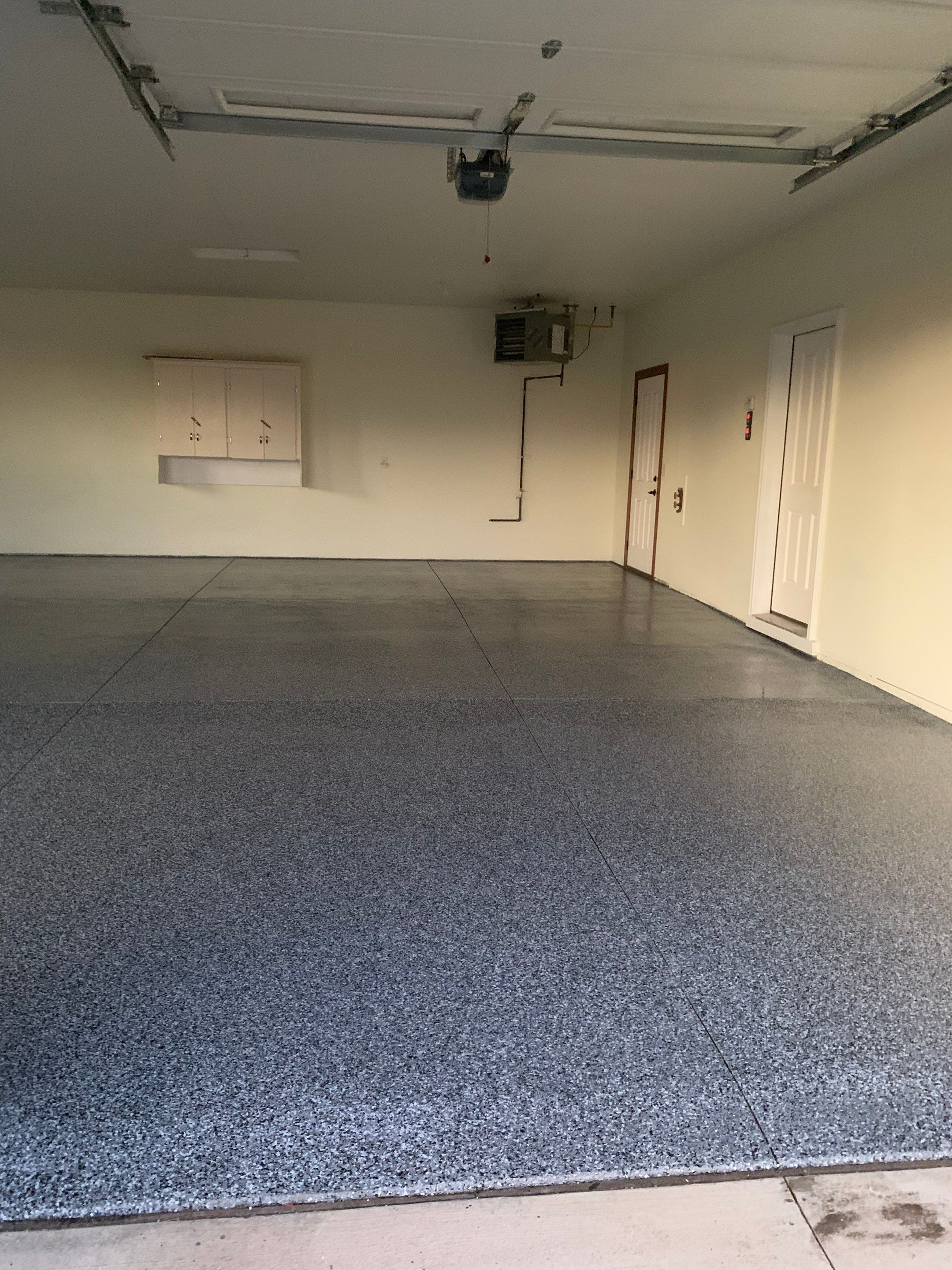 Speckled Epoxy Garage Floor Coating and Concrete Repair in Lennox by Select Painting, Coatings & Garage Cabinets