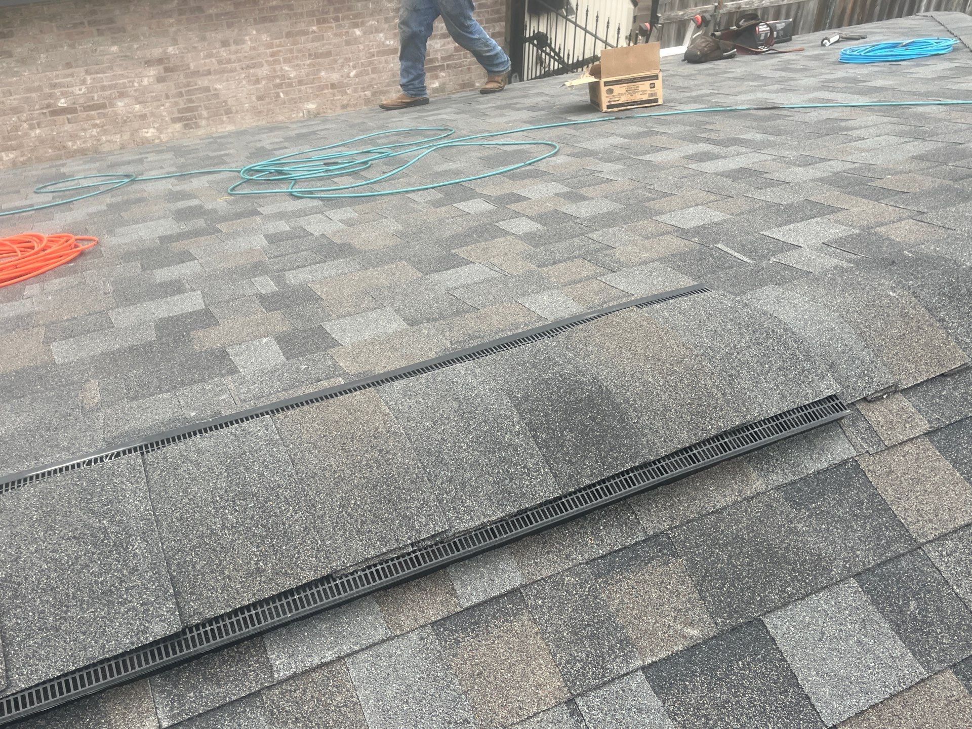 Colored Vinyl Windows to blend into brick by Bayfront Roofing and Construction