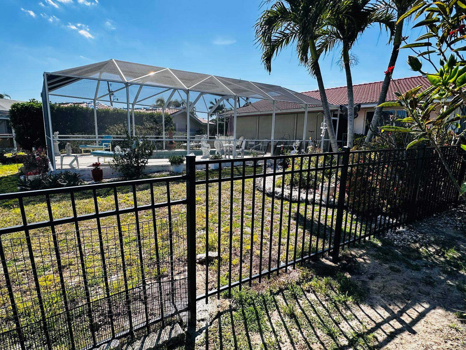 Waterfront Aluminum Picket Fence Installation in Punta Gorda by True Fence LLC