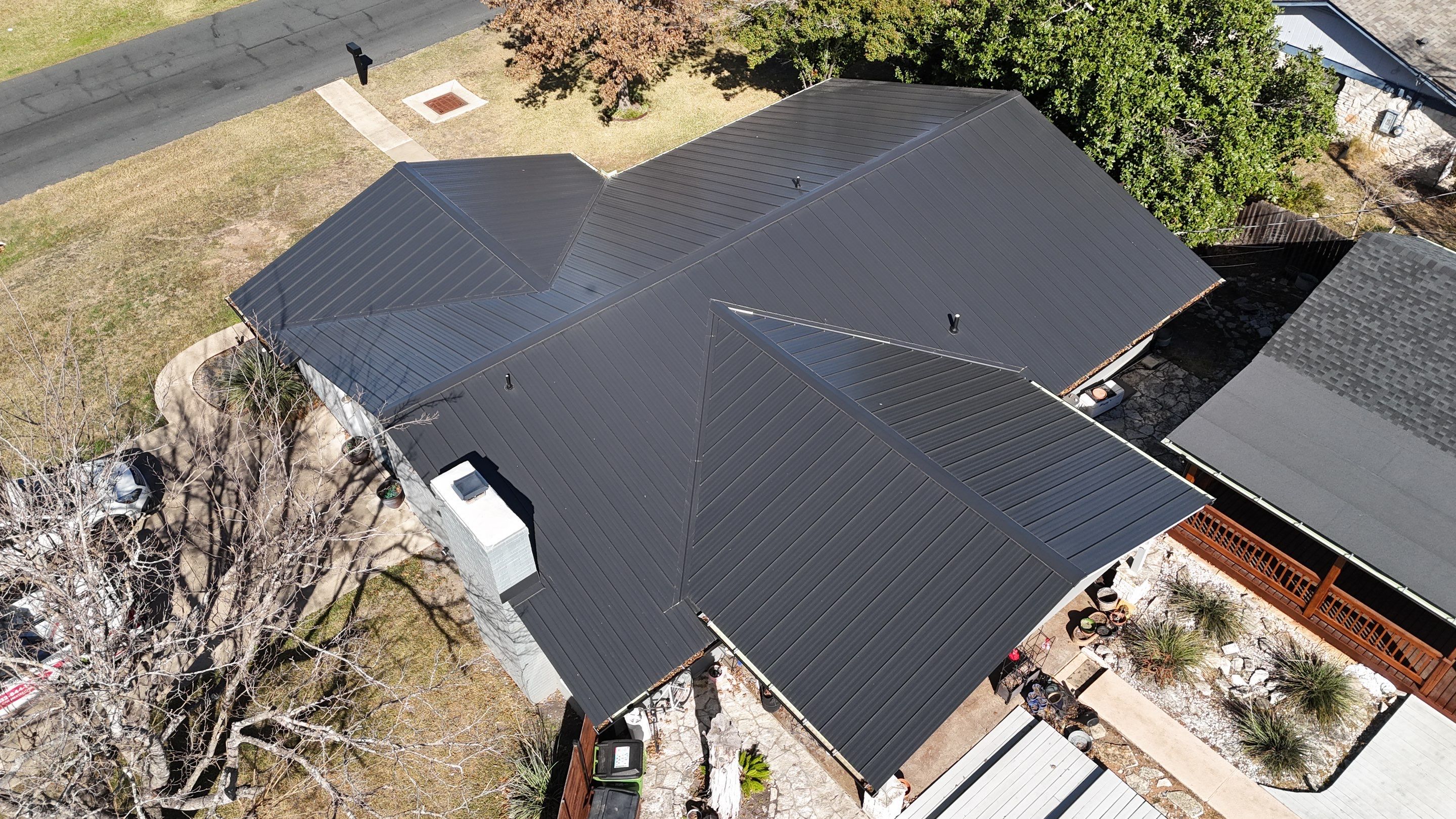 Residential Roof Replacement using Matte Black 24g by Action Exteriors Austin