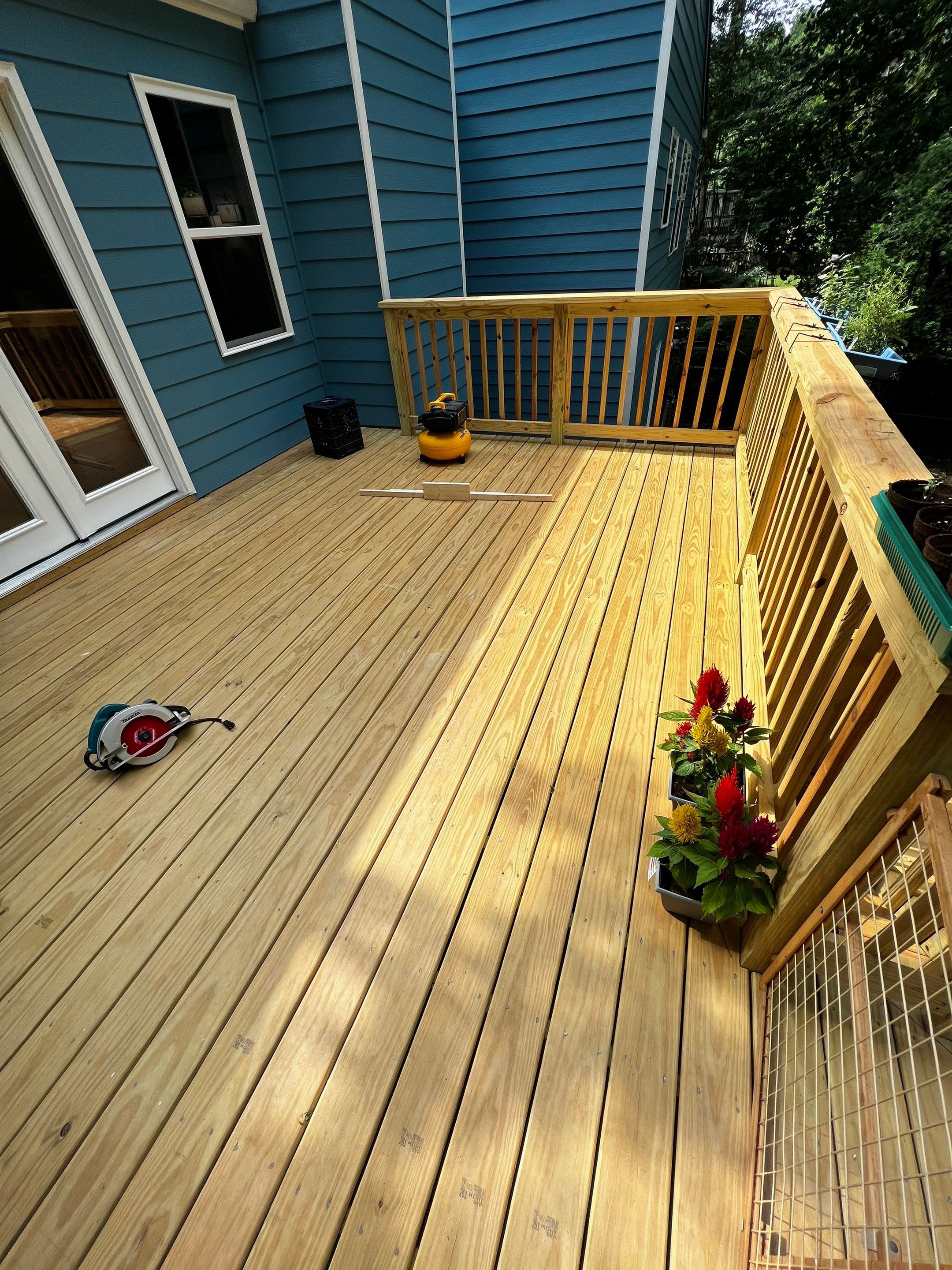 Elevated Wood Deck and Blue Lap Siding Installation in Kennesaw by Swift Home Renovations