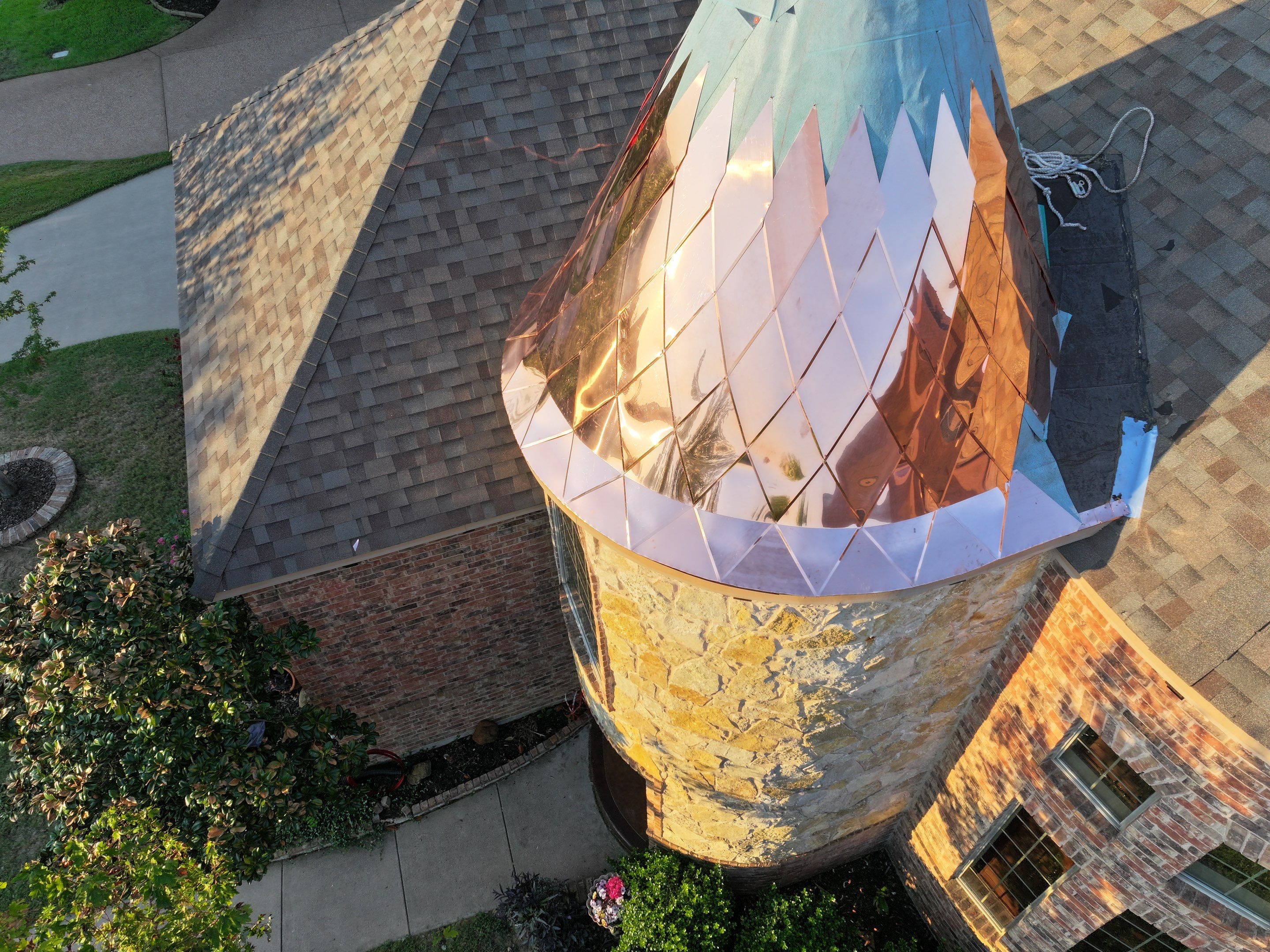 Installing Custom copper turret and Malarkey Vista Class 4 shingles Hail Damage Upgrade by Becker Roofing and Exteriors