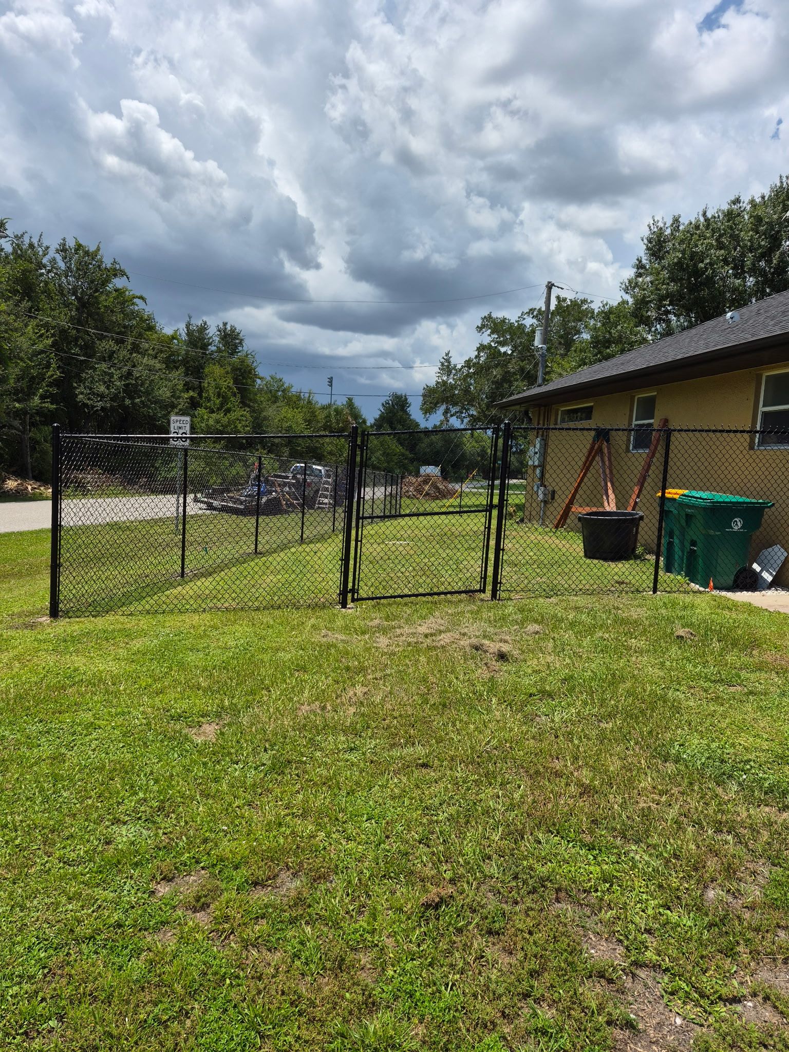 Black Chain Link Perimeter Fencing with Double Gates in Port Charlotte by True Fence LLC