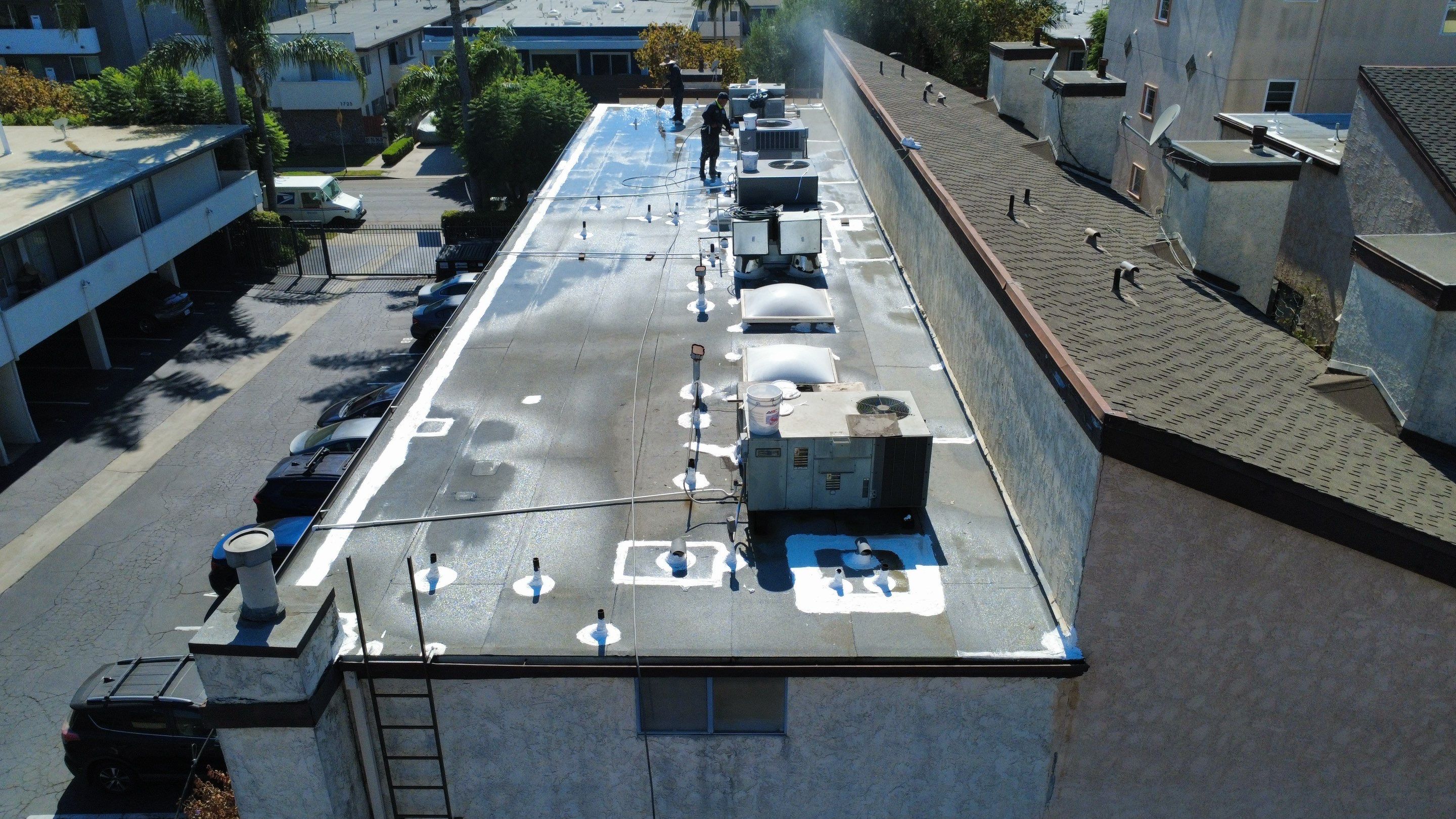 Apartment Building Silicone Coating by Hull Brothers Roofing